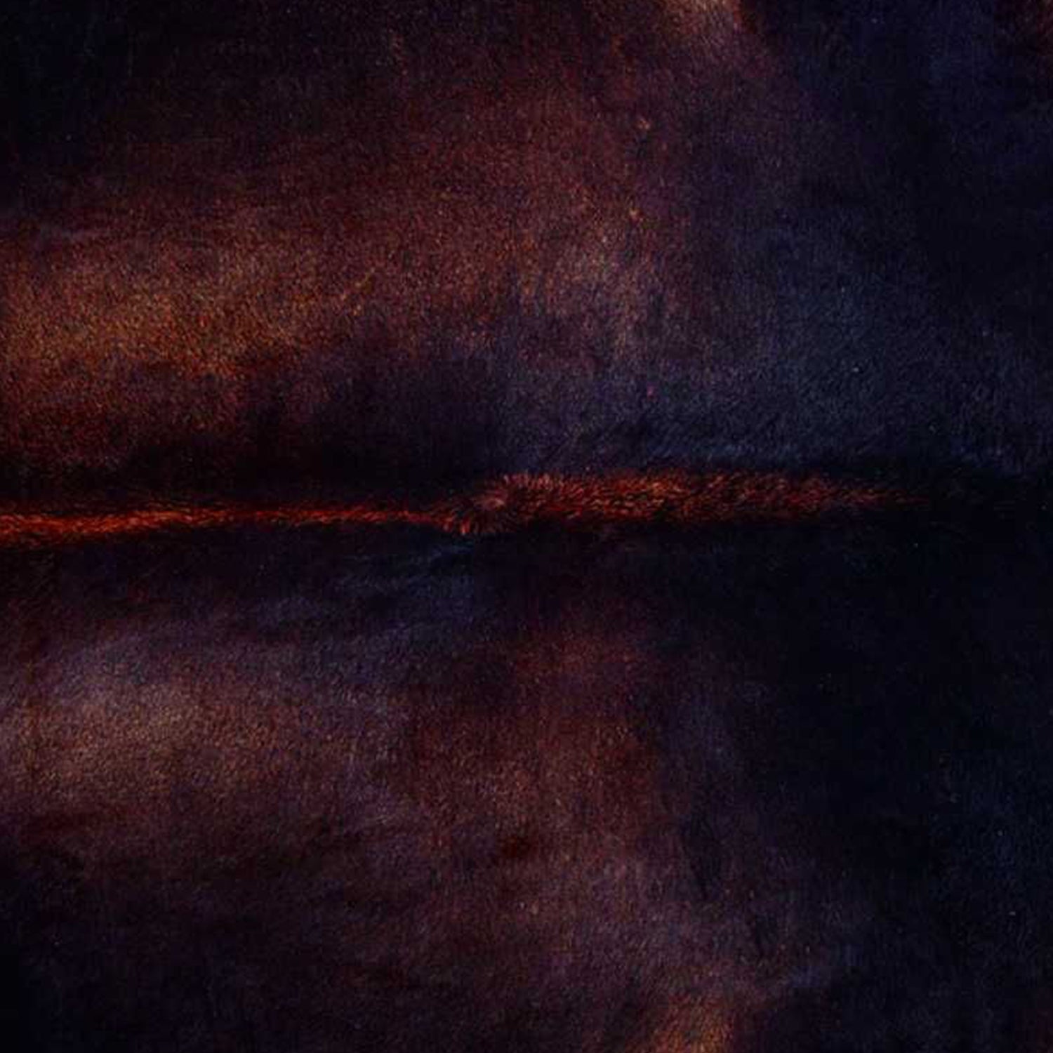 Handmade black and white cowhide area rug measuring 60x84 inches, showcasing a luxurious texture and unique patterns.