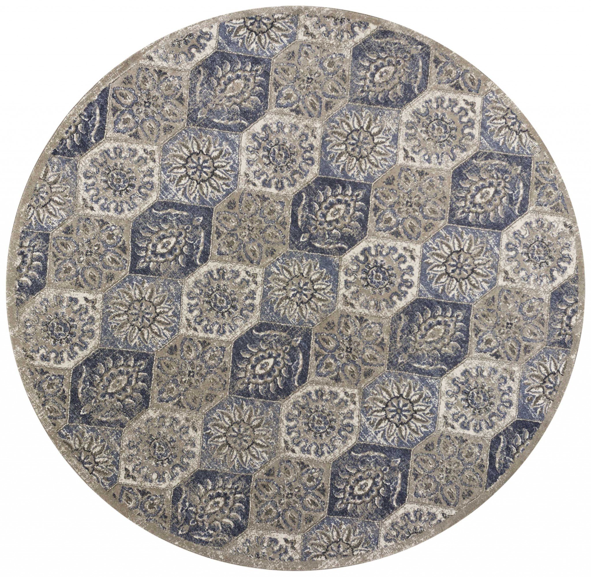 A 63" X 91" Pewter Polypropylene Rug featuring a vintage mosaic pattern, showcasing a plush texture and trendy colors.