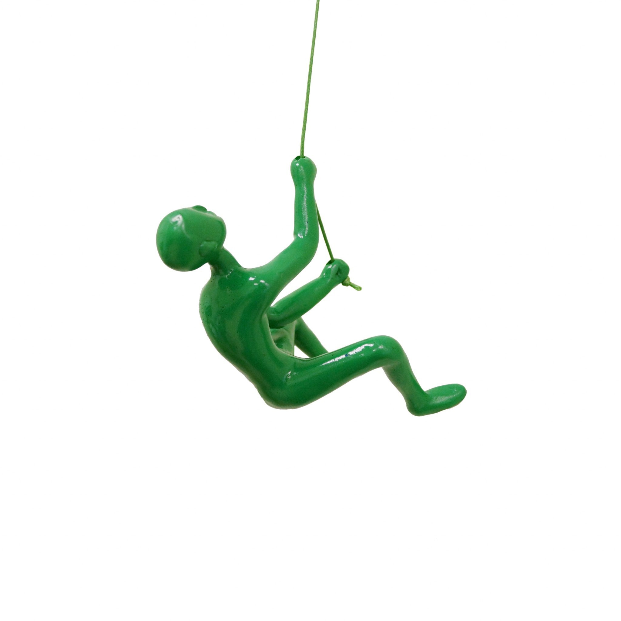 A striking green resin sculpture of a man climbing, designed for wall art, showcasing a modern aesthetic.