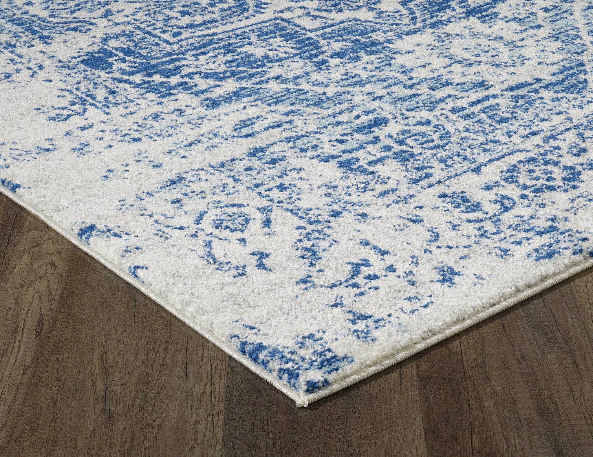 7' Ivory Blue Machine Woven Distressed Medallion Indoor Runner Rug showcasing a stylish medallion pattern in ivory and blue tones.