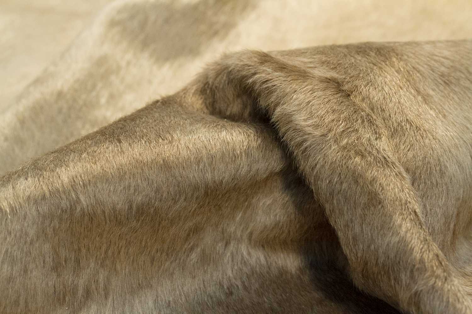 Luxurious 72x84 inches brown cowhide rug showcasing rich texture and color, perfect for modern home decor.