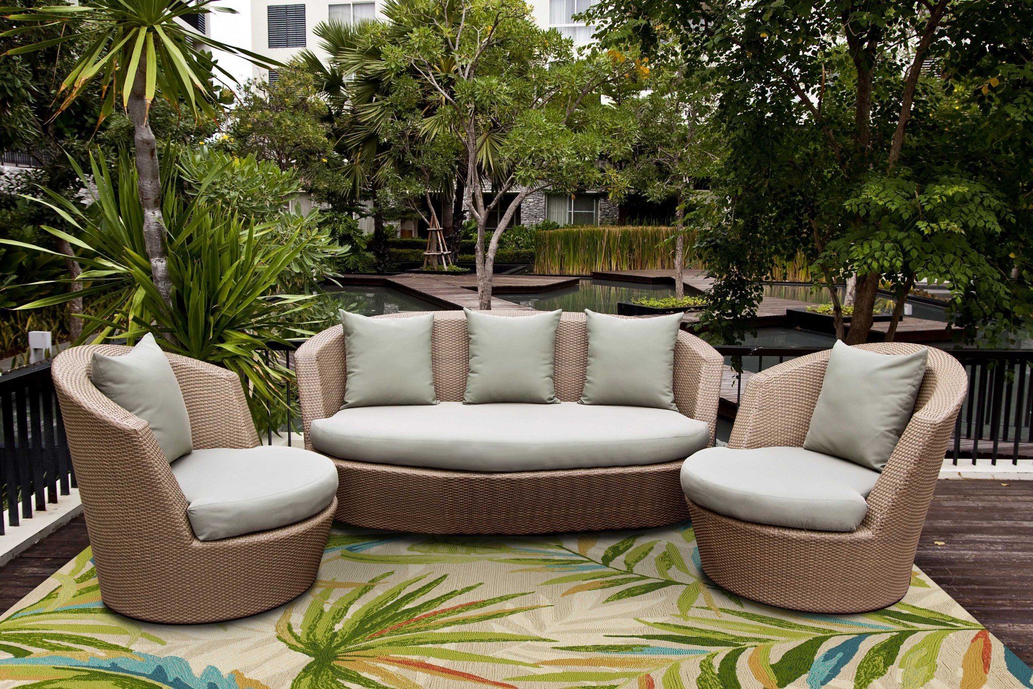 7x9 UV treated polypropylene sand area rug with modern paint-dripping design, perfect for indoor and outdoor use.