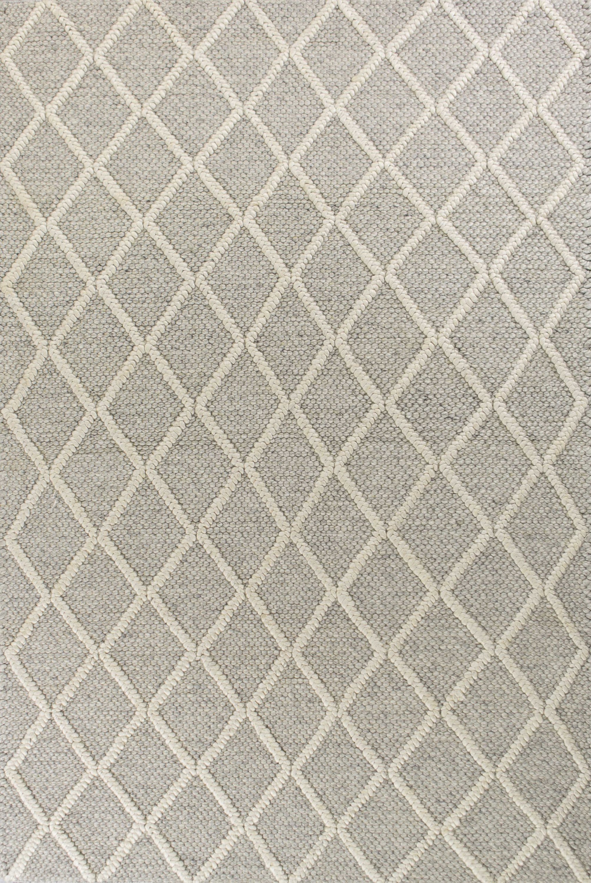 A luxurious 7x9 wool grey area rug featuring a modern grey diamonds pattern, perfect for enhancing contemporary home decor.