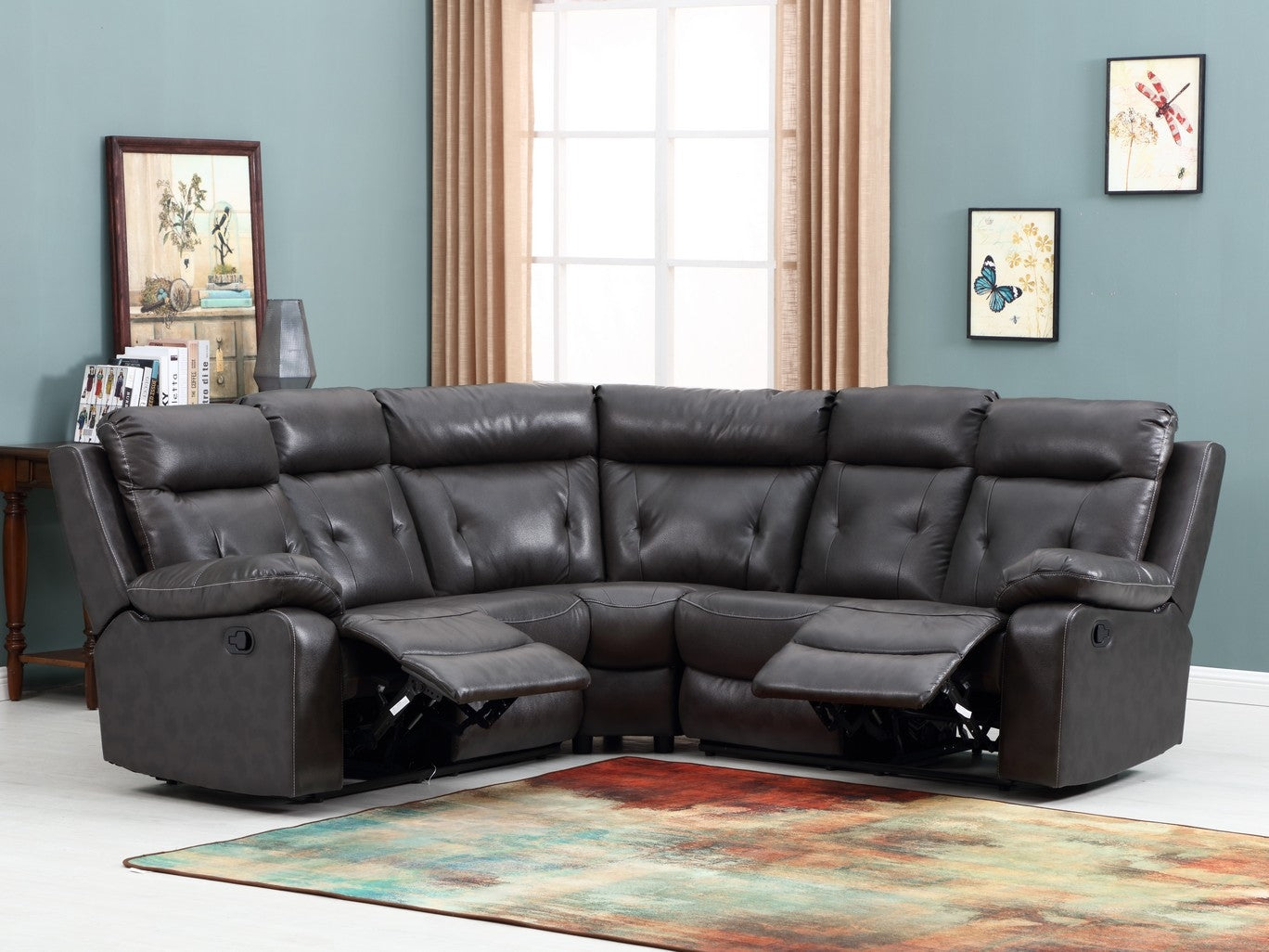A spacious dark gray sectional sofa measuring 80x80x40 inches, featuring manual reclining capabilities and faux leather upholstery.