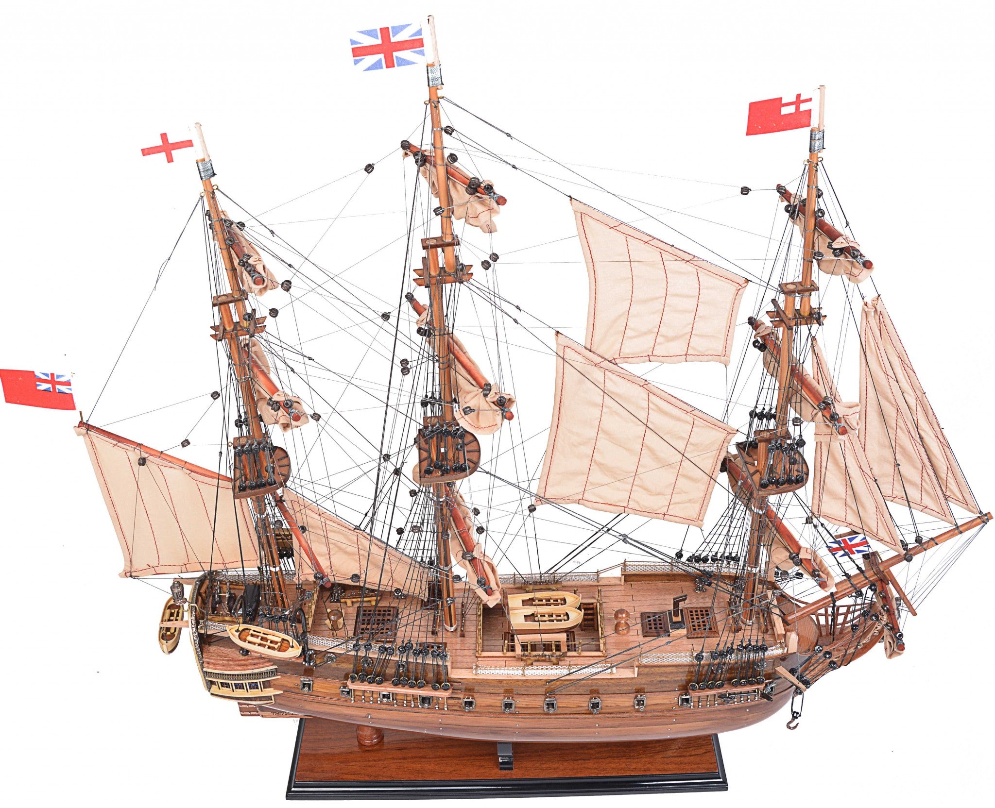 Detailed model of the H.M.S. Surprise, an 18th-century tall ship replica, showcasing intricate wooden craftsmanship and vibrant colors.