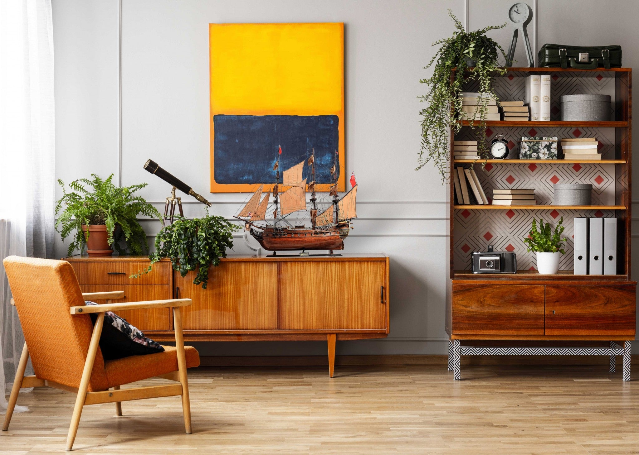 Detailed model of the H.M.S. Surprise, an 18th-century tall ship replica, showcasing intricate wooden craftsmanship and vibrant colors.