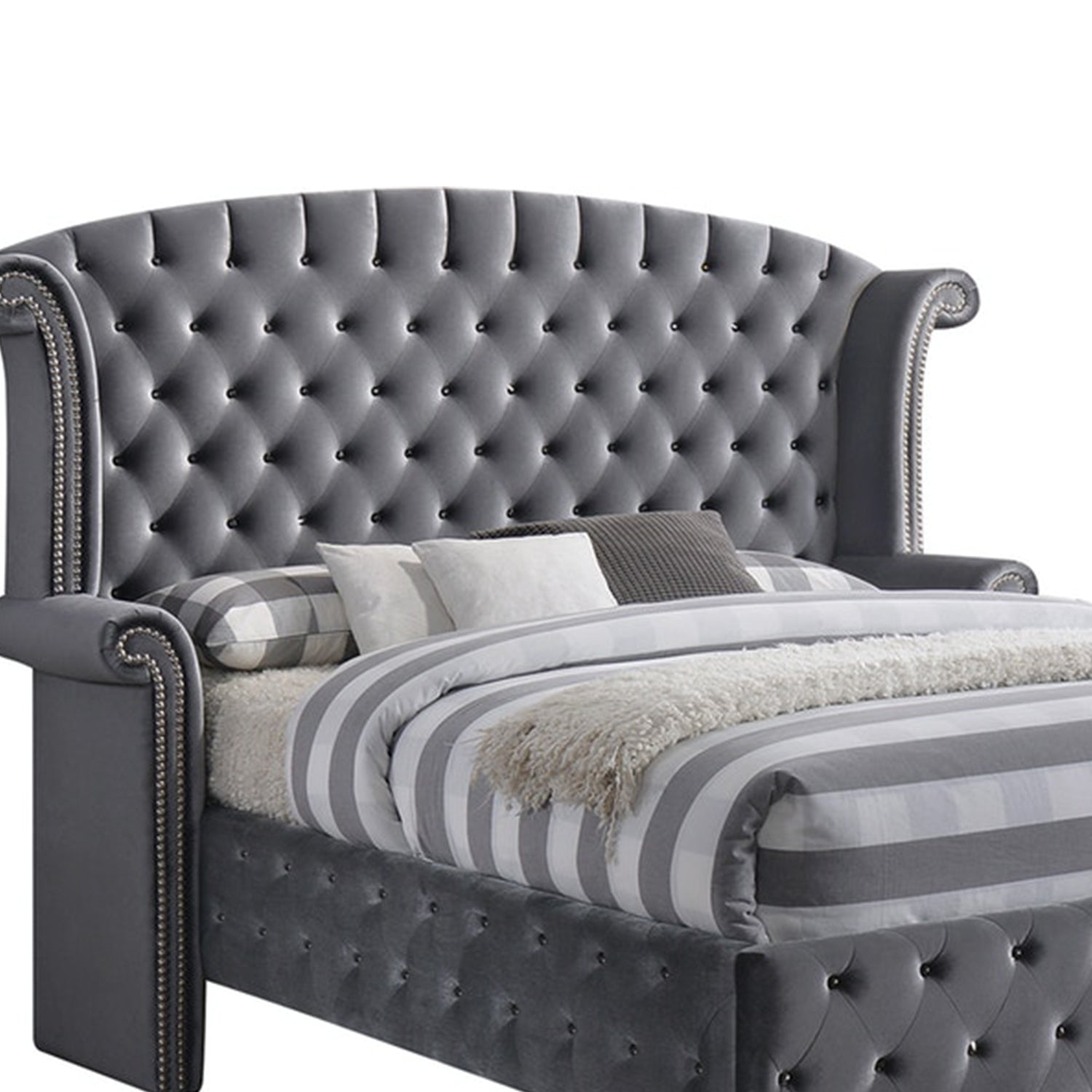 Gray Velvet Queen Bed with padded wingback headboard and button tufting, showcasing a luxurious and elegant design.