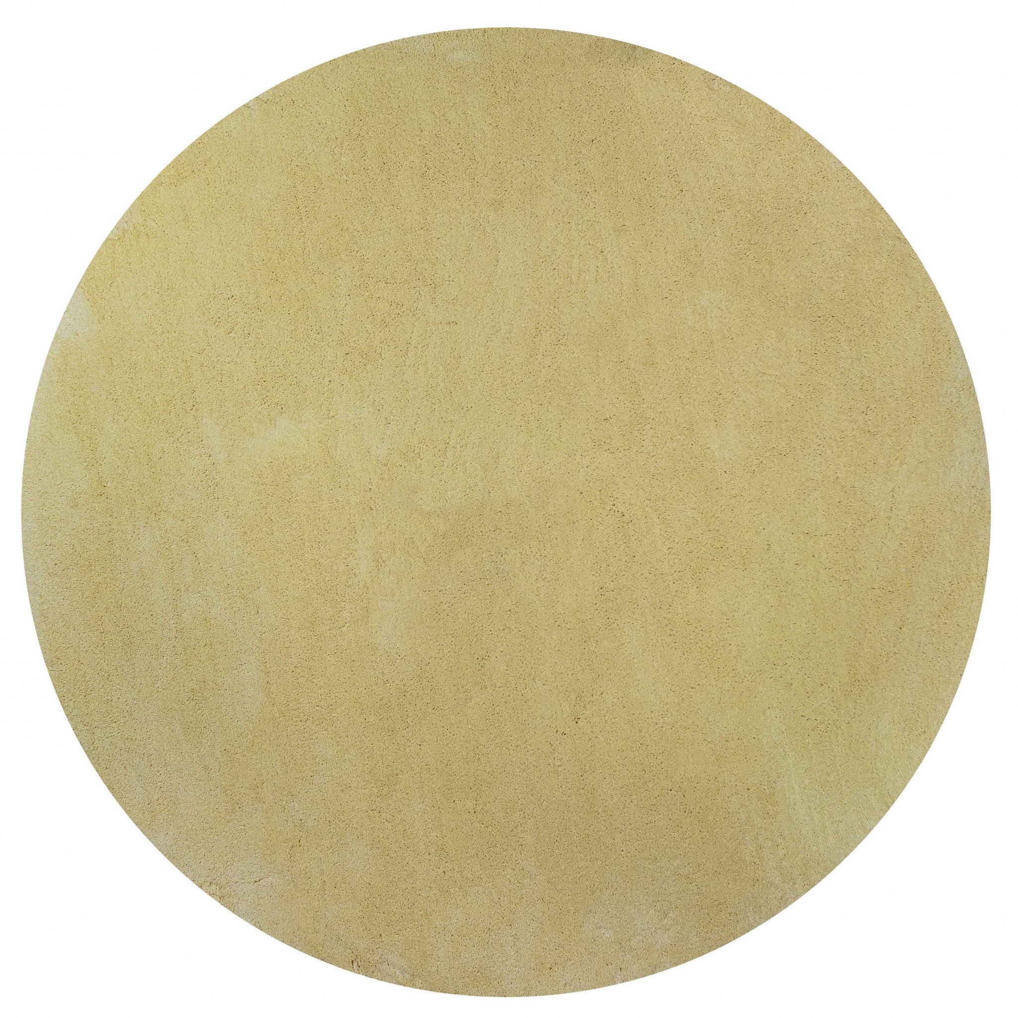 A vibrant 8-inch round canary yellow shag rug, showcasing its soft texture and bright color, perfect for indoor spaces.