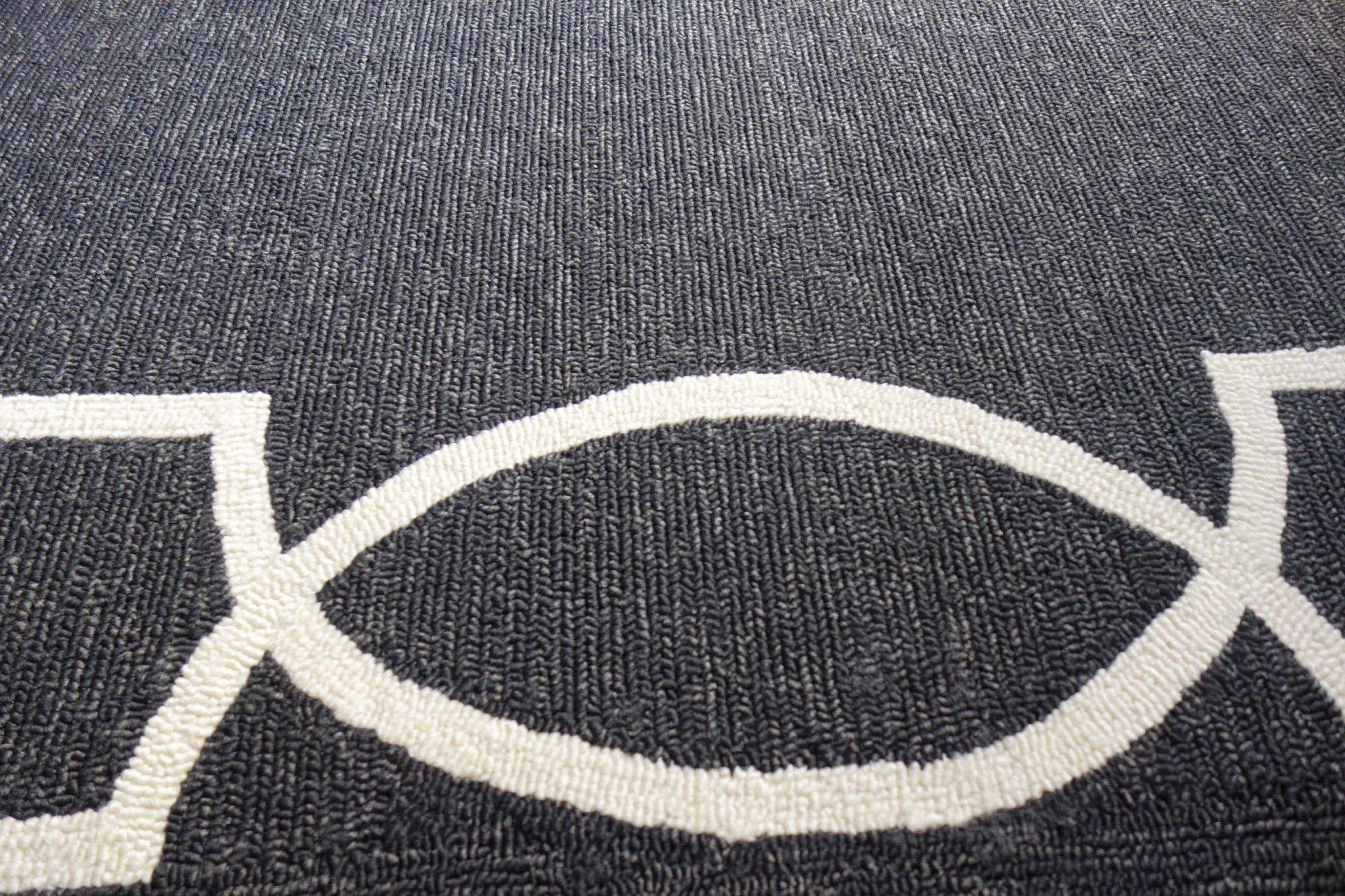 8-inch grey machine woven traditional quatrefoil round indoor area rug with metallic accents, showcasing an elegant pattern and soft texture.