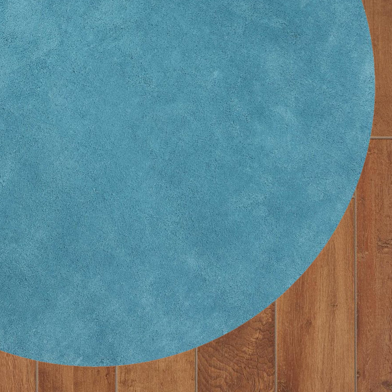 8-inch round polyester highlighter blue area rug with a plush texture, perfect for modern home decor.