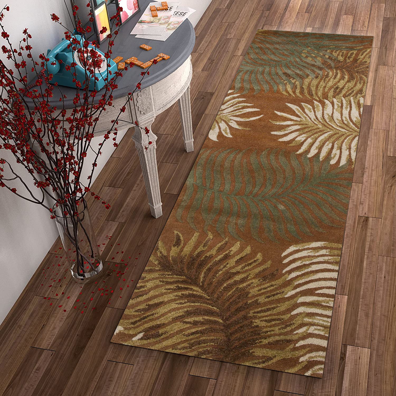 8-inch rust orange hand tufted indoor runner rug featuring tropical leaves design, showcasing vibrant colors and intricate texture.