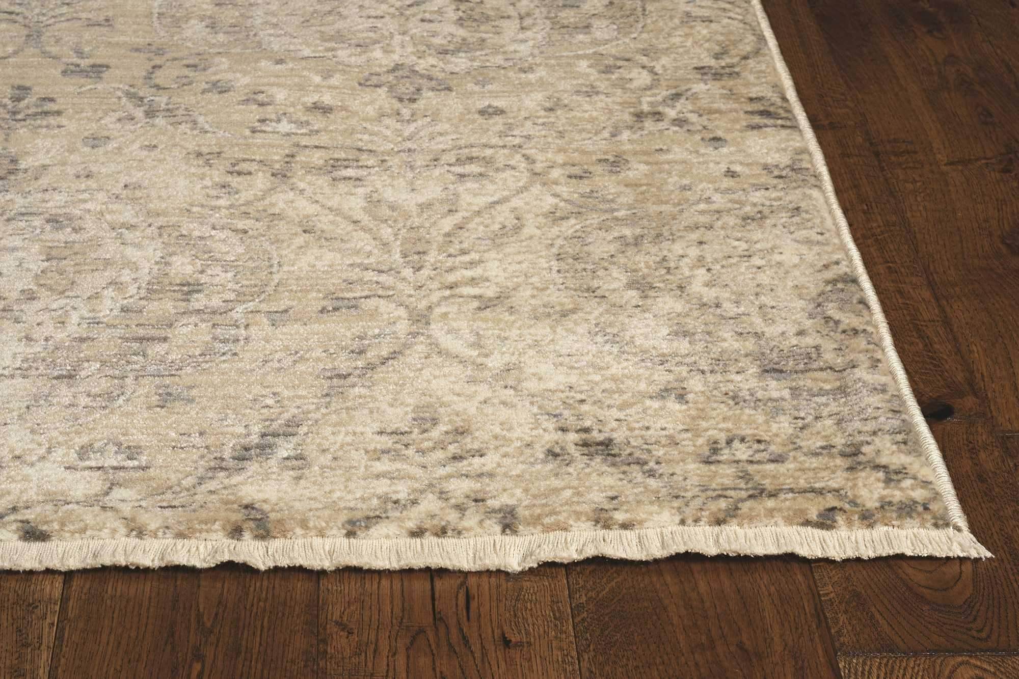 8-inch sand and charcoal polypropylene runner rug with a distressed vintage design, perfect for enhancing living spaces.