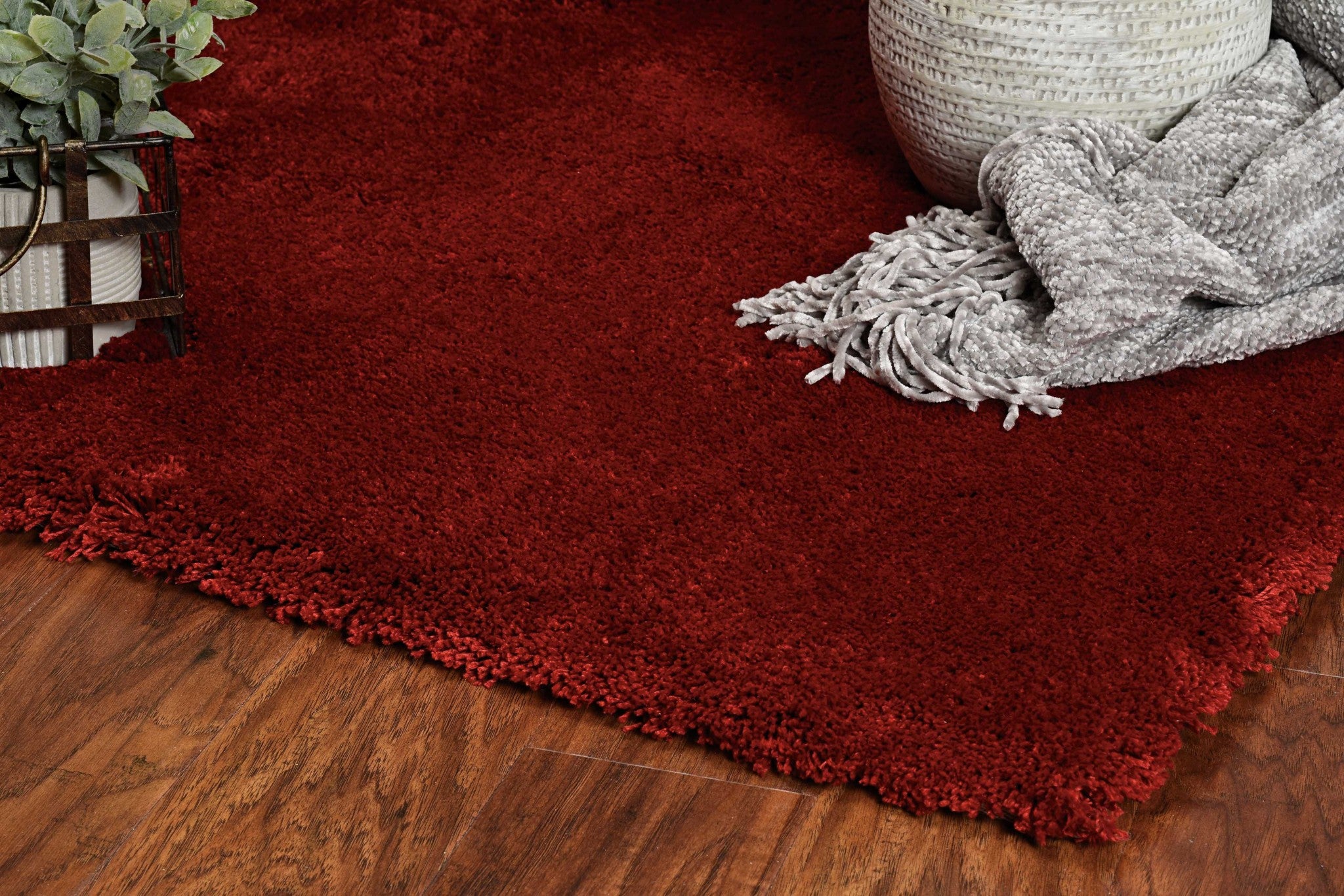 A vibrant 8x10 inches red shag area rug made of high-grade polyester, showcasing a contemporary design suitable for modern interiors.
