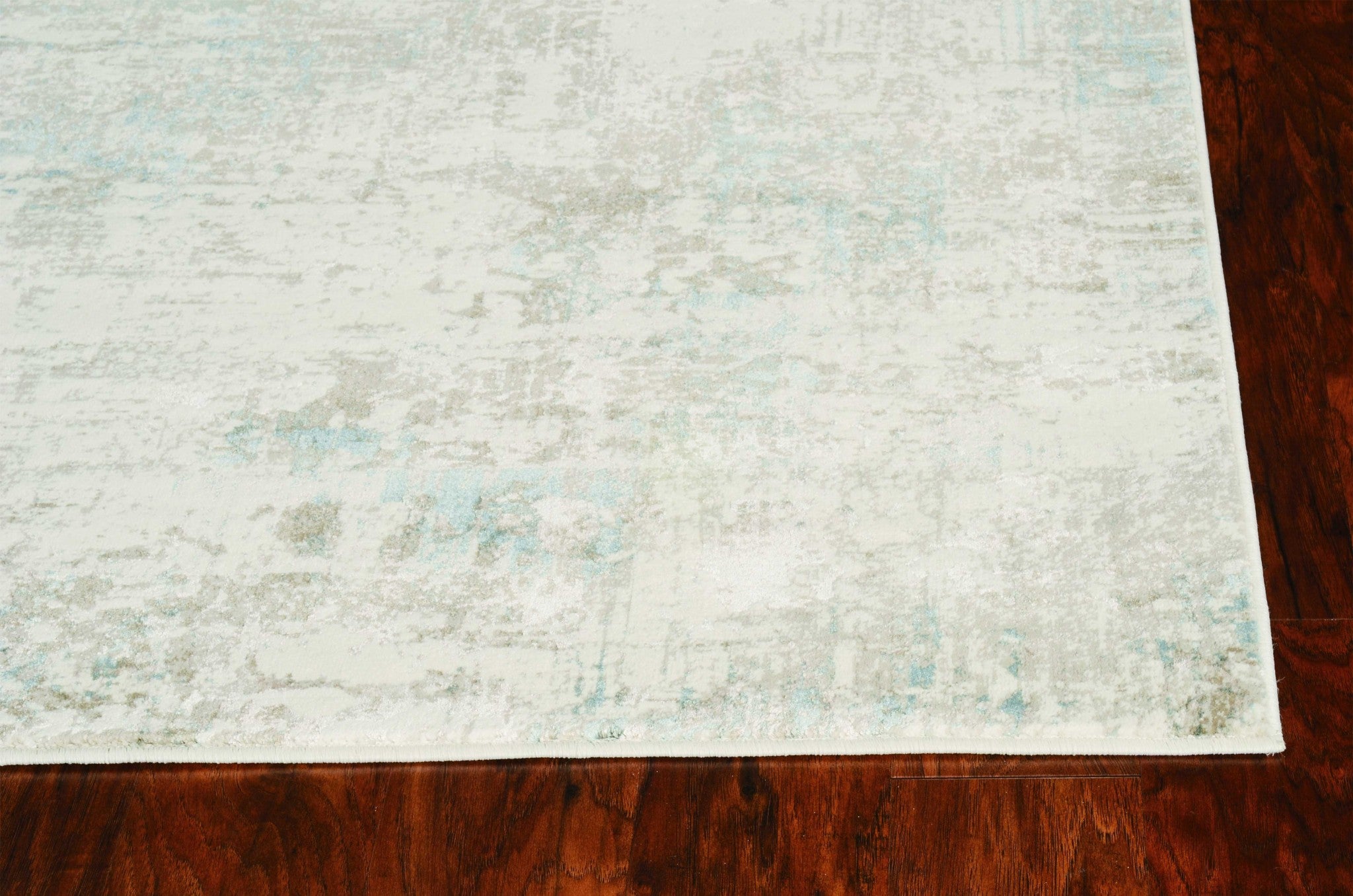 8x10 ivory grey machine woven geometric indoor area rug showcasing modern design and soft texture.