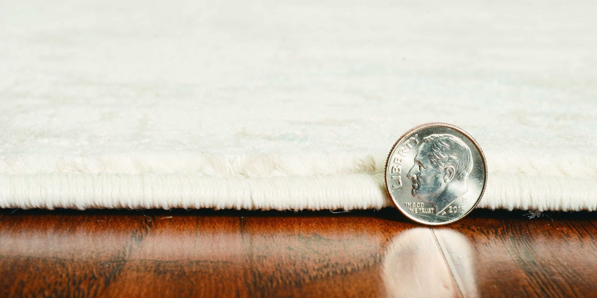 8x10 ivory grey machine woven geometric indoor area rug showcasing modern design and soft texture.