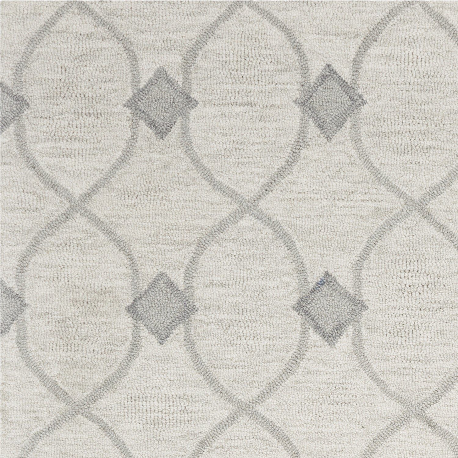 8 inches x 10 inches ivory hand-tufted ogee indoor area rug with a geometric design, showcasing its luxurious wool texture.