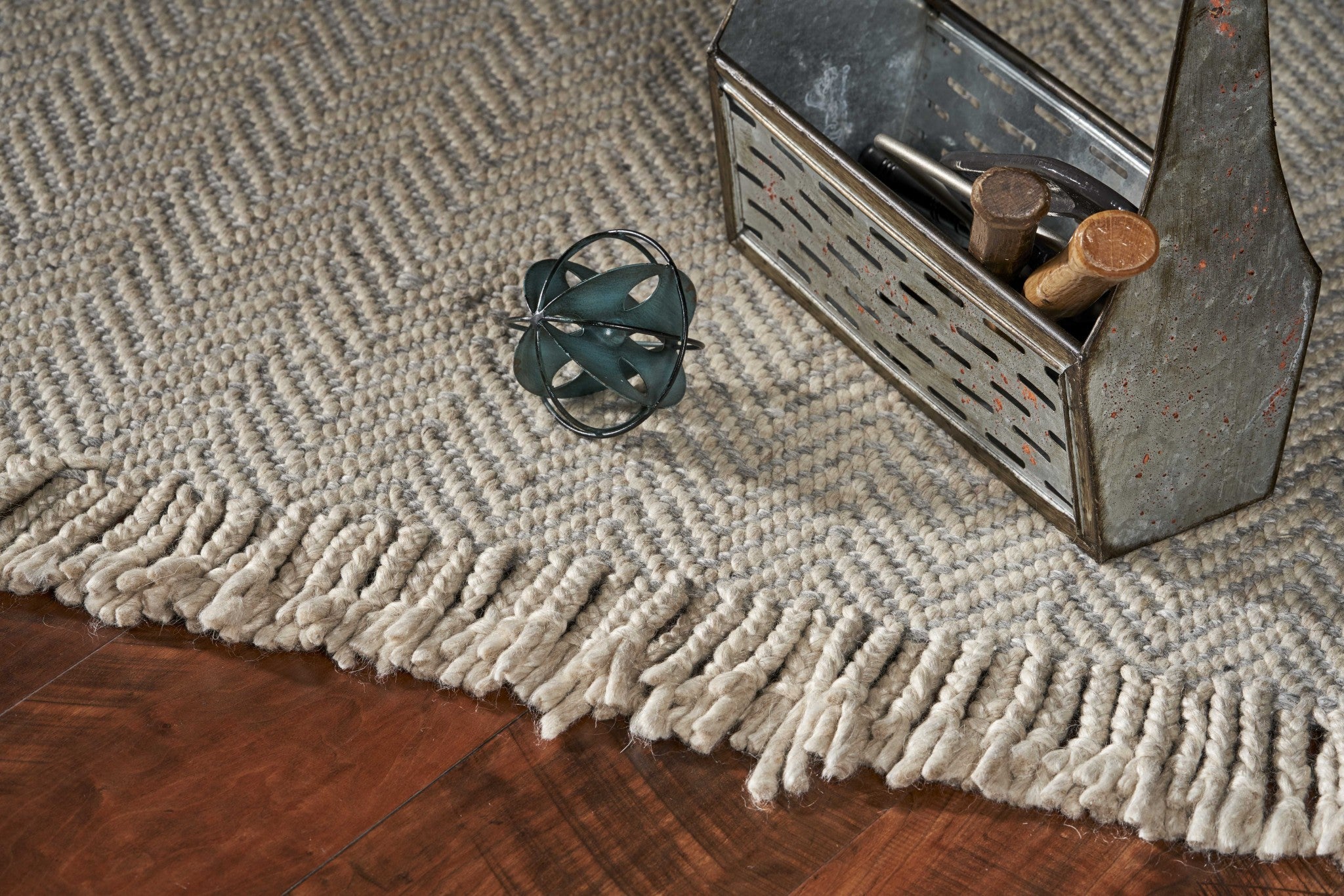8 inches x 10 inches oatmeal beige hand woven herringbone indoor area rug with braided fringe, showcasing a modern design and high-quality wool material.