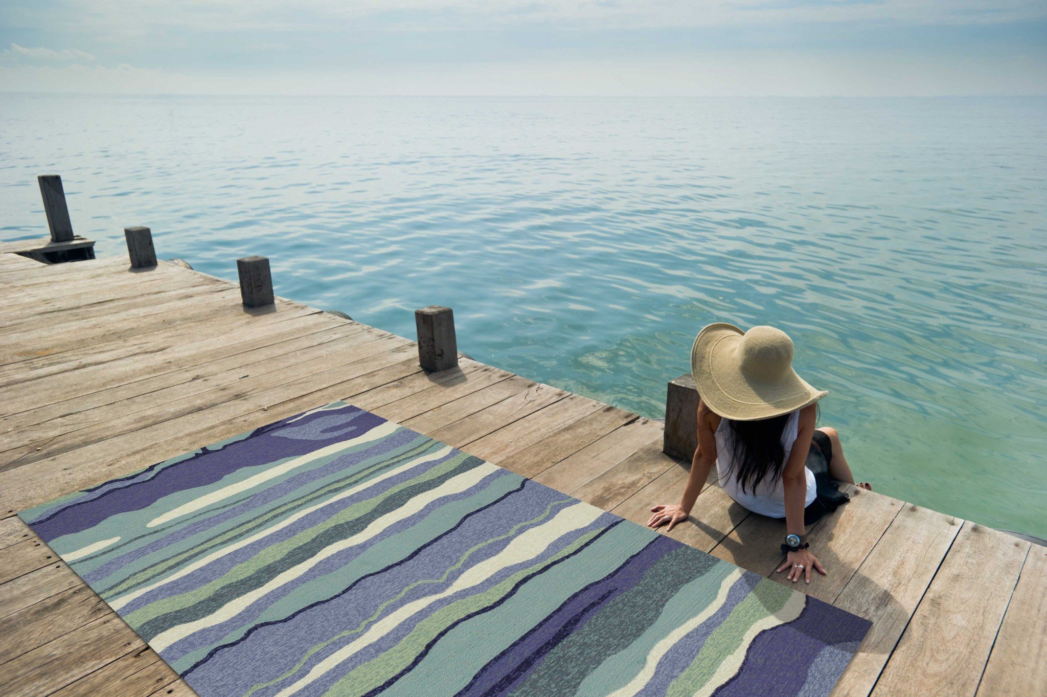 8x10 Ocean Blue Hand Woven Rug with wave patterns, suitable for indoor and outdoor use.