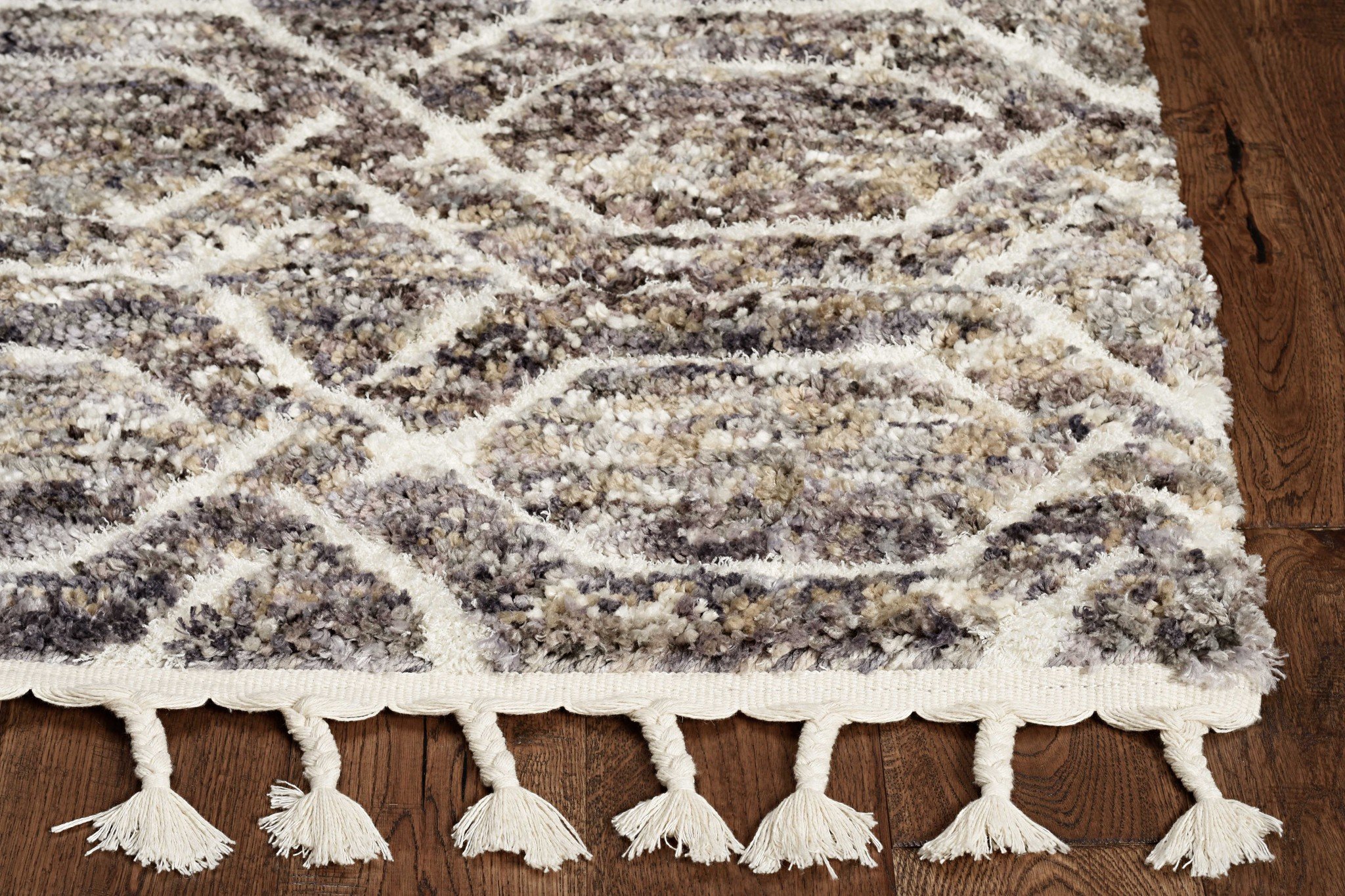 8x10 Silver Ivory Hand Tufted Vermicular Indoor Area Rug showcasing intricate patterns and muted colors, perfect for enhancing home decor.