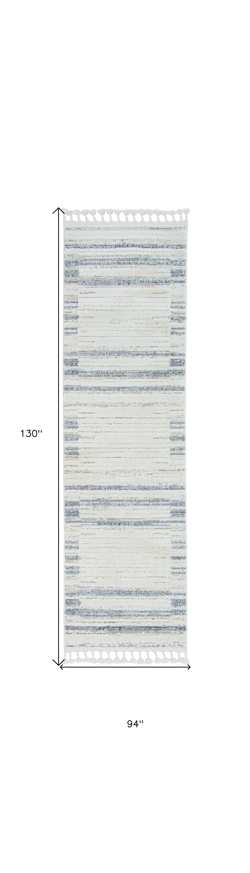A stylish 94 x 130 ivory grey polyester rug with decorative cut loop pile and fringe, perfect for contemporary living spaces.