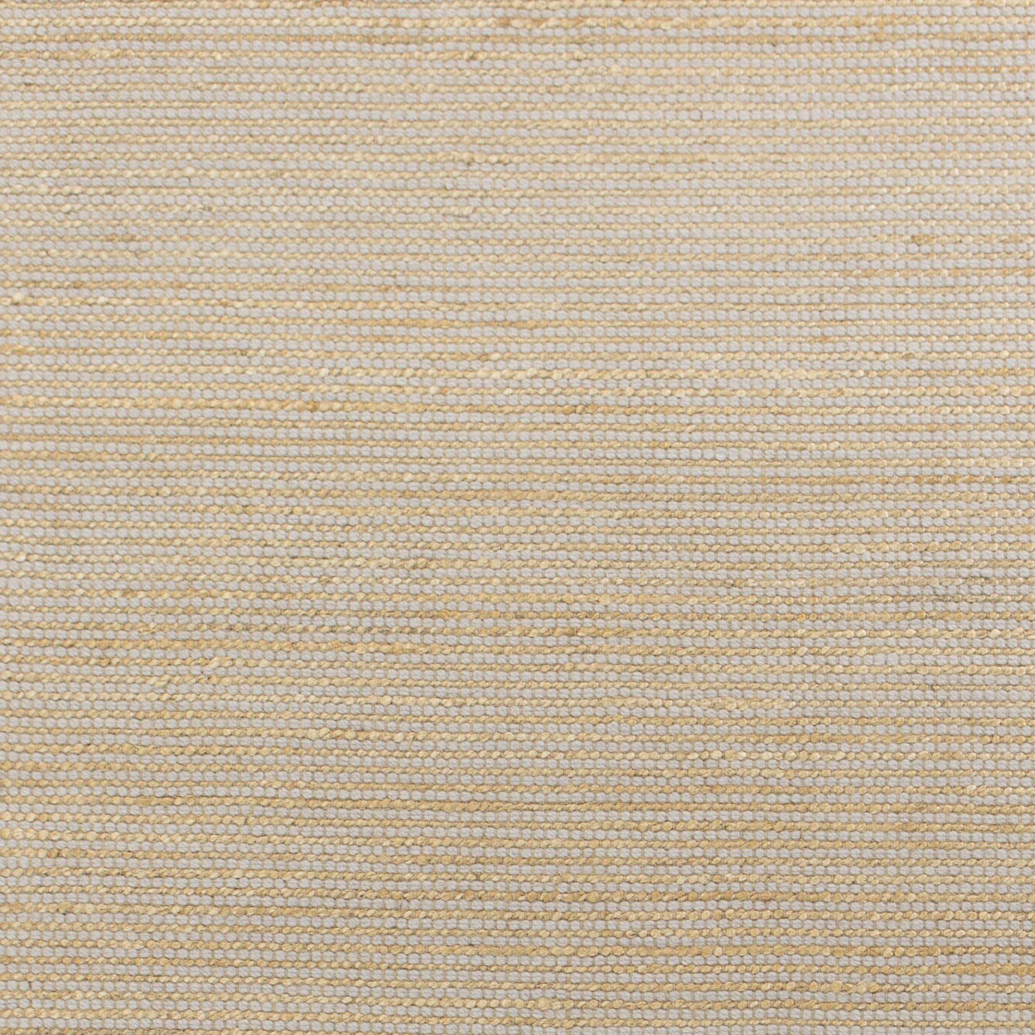 A hand-woven grey wool and jute rug measuring 96 x 126 inches, showcasing a textured surface and cotton backing, perfect for contemporary living spaces.