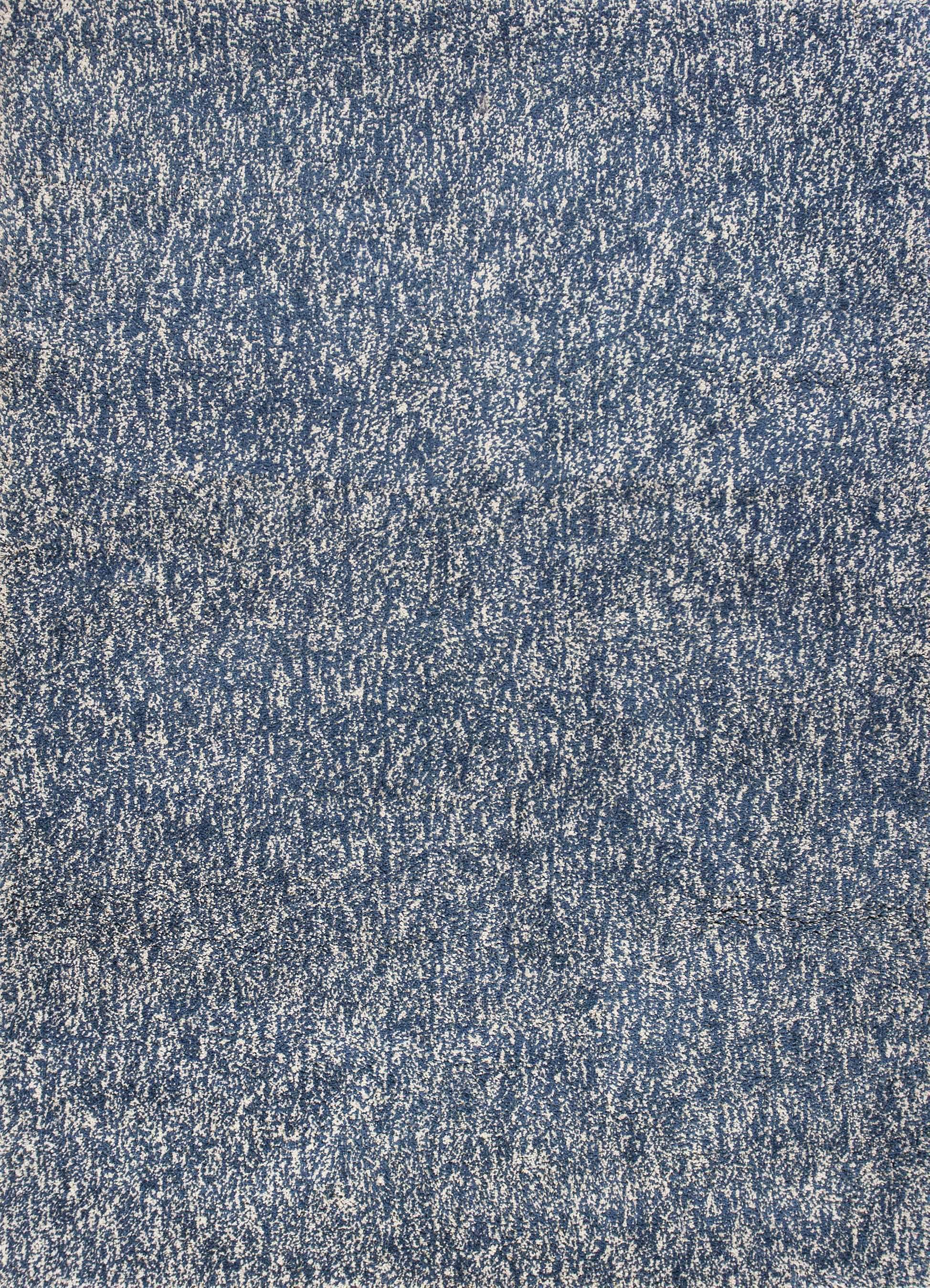 A beautiful 9x13 inches area rug in indigo and ivory heather, showcasing a contemporary design suitable for modern home decor.