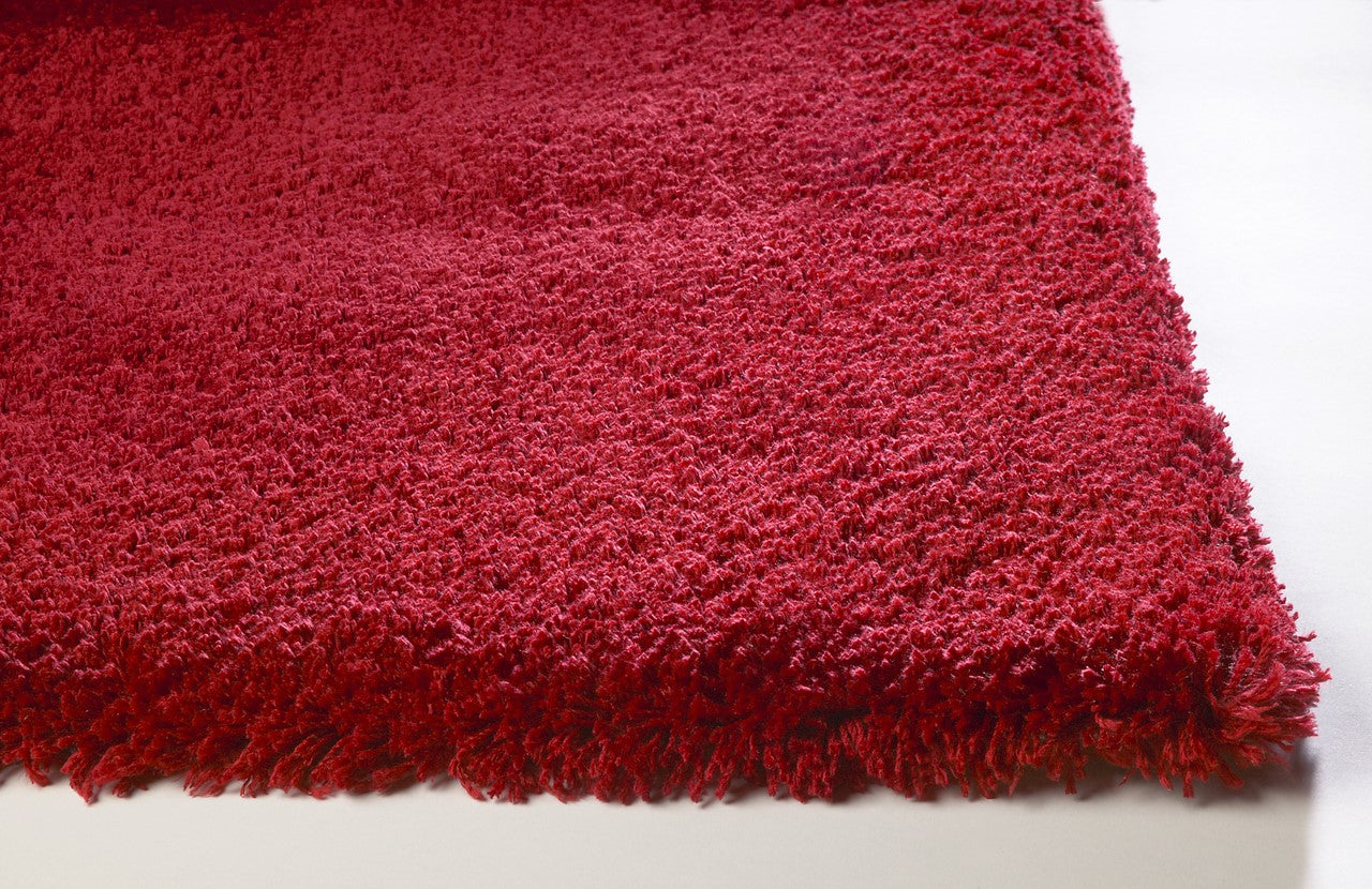 A vibrant 9x13 inches red shag area rug with a soft texture, perfect for enhancing modern home decor.