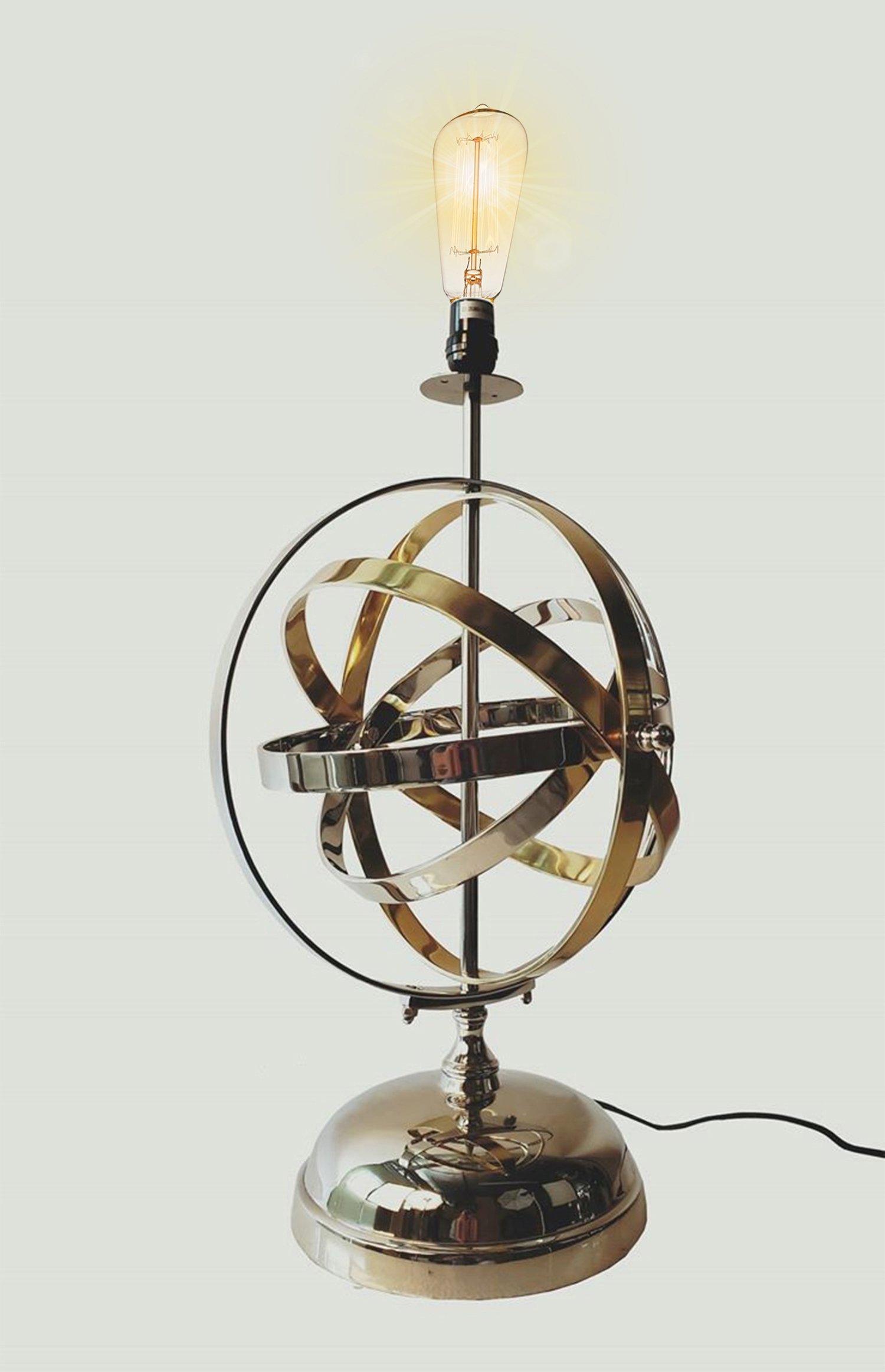 Armillary Sphere Aluminum Table Lamp featuring rotating silver and gold rings, elegant design, and a glossy finish.
