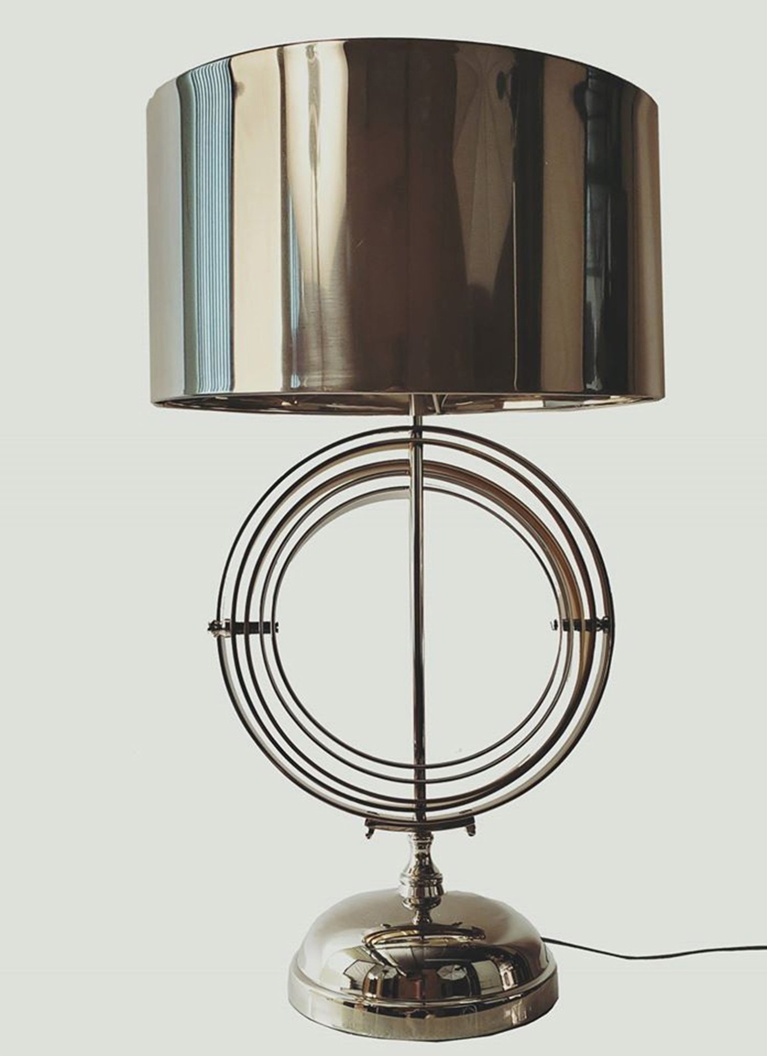 Armillary Sphere Aluminum Table Lamp featuring rotating silver and gold rings, elegant design, and a glossy finish.