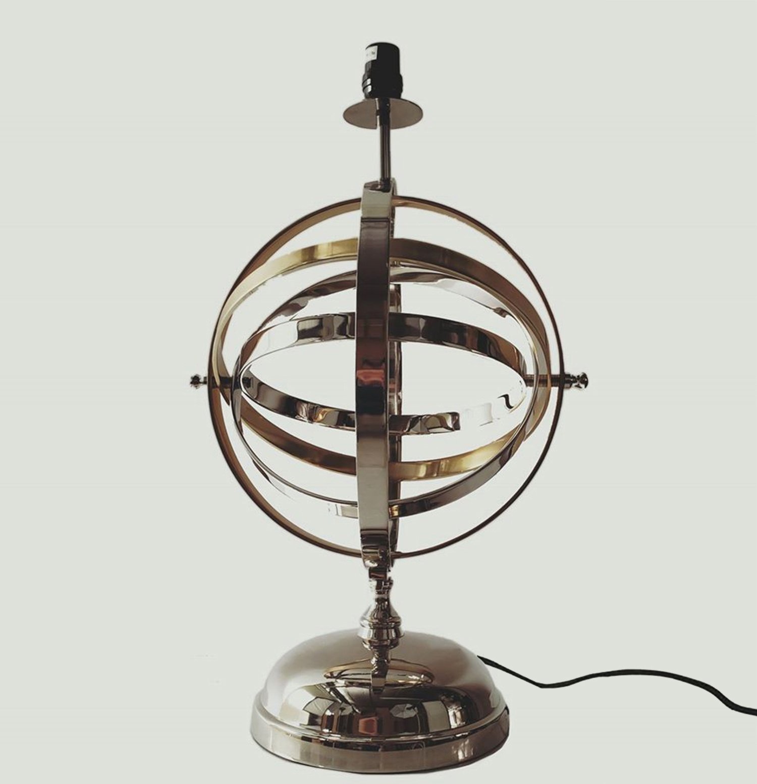 Armillary Sphere Aluminum Table Lamp featuring rotating silver and gold rings, elegant design, and a glossy finish.