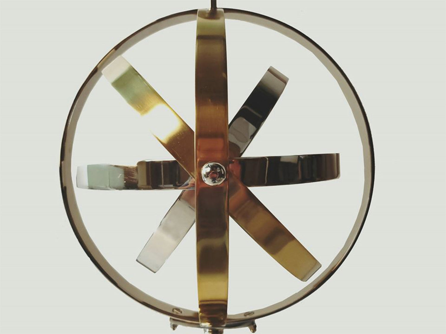 Armillary Sphere Aluminum Table Lamp featuring rotating silver and gold rings, elegant design, and a glossy finish.