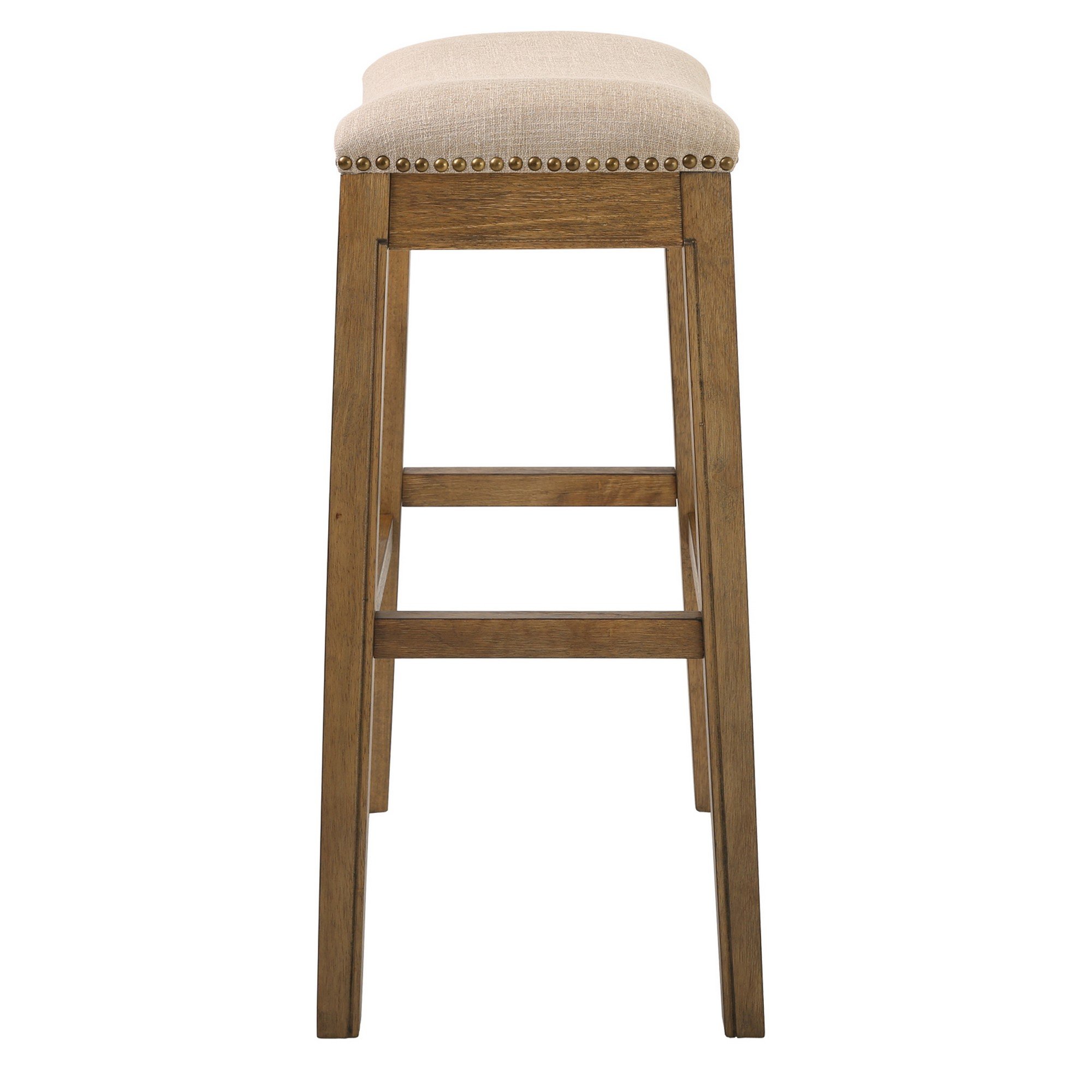 Bar Height Saddle Style Counter Stool with cream fabric upholstery and antique brass nail head accents, showcasing a solid wood frame.