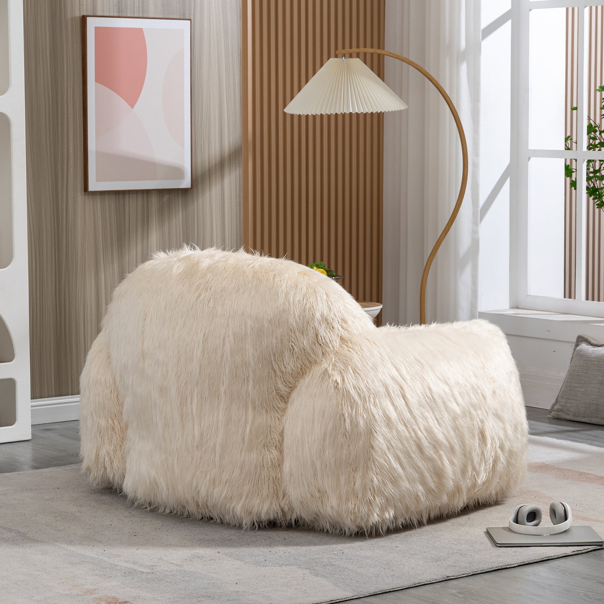 A stylish beige bean bag chair made of faux fur, designed for comfort and relaxation, suitable for adults and teens.