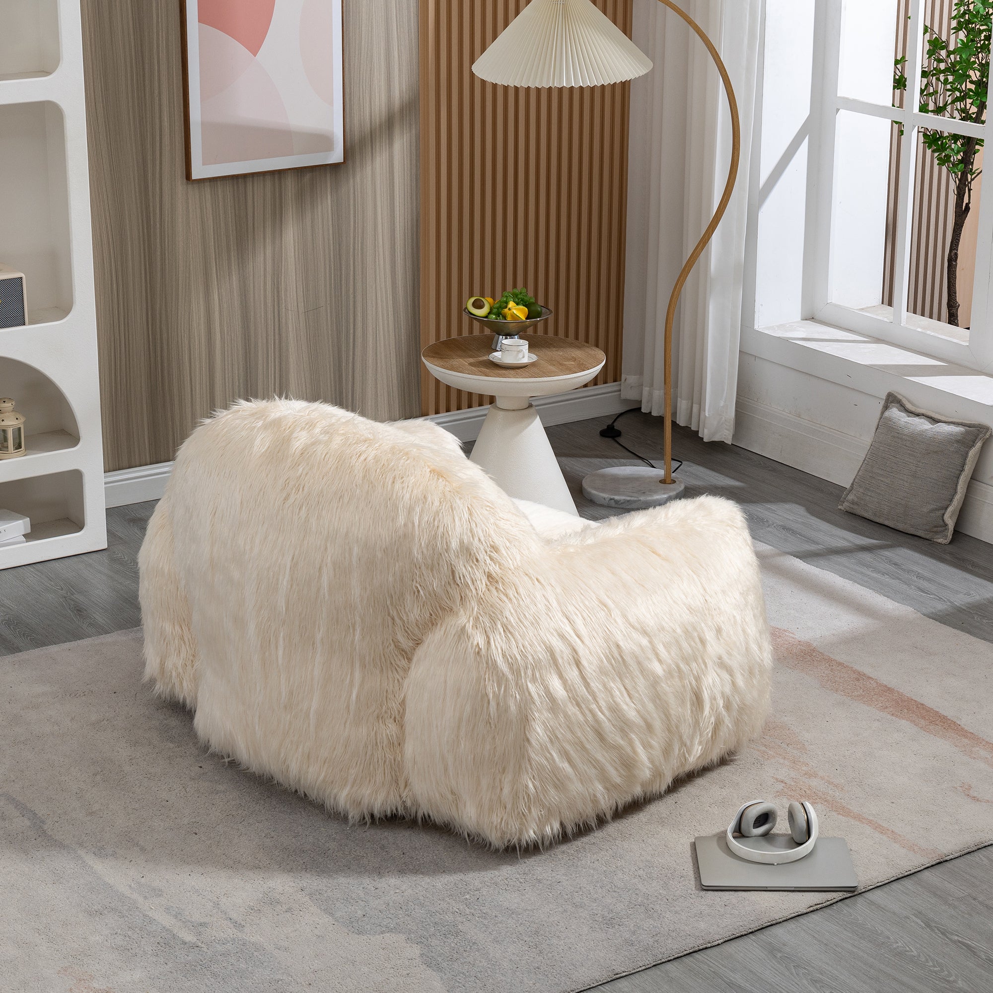 A stylish beige bean bag chair made of faux fur, designed for comfort and relaxation, suitable for adults and teens.