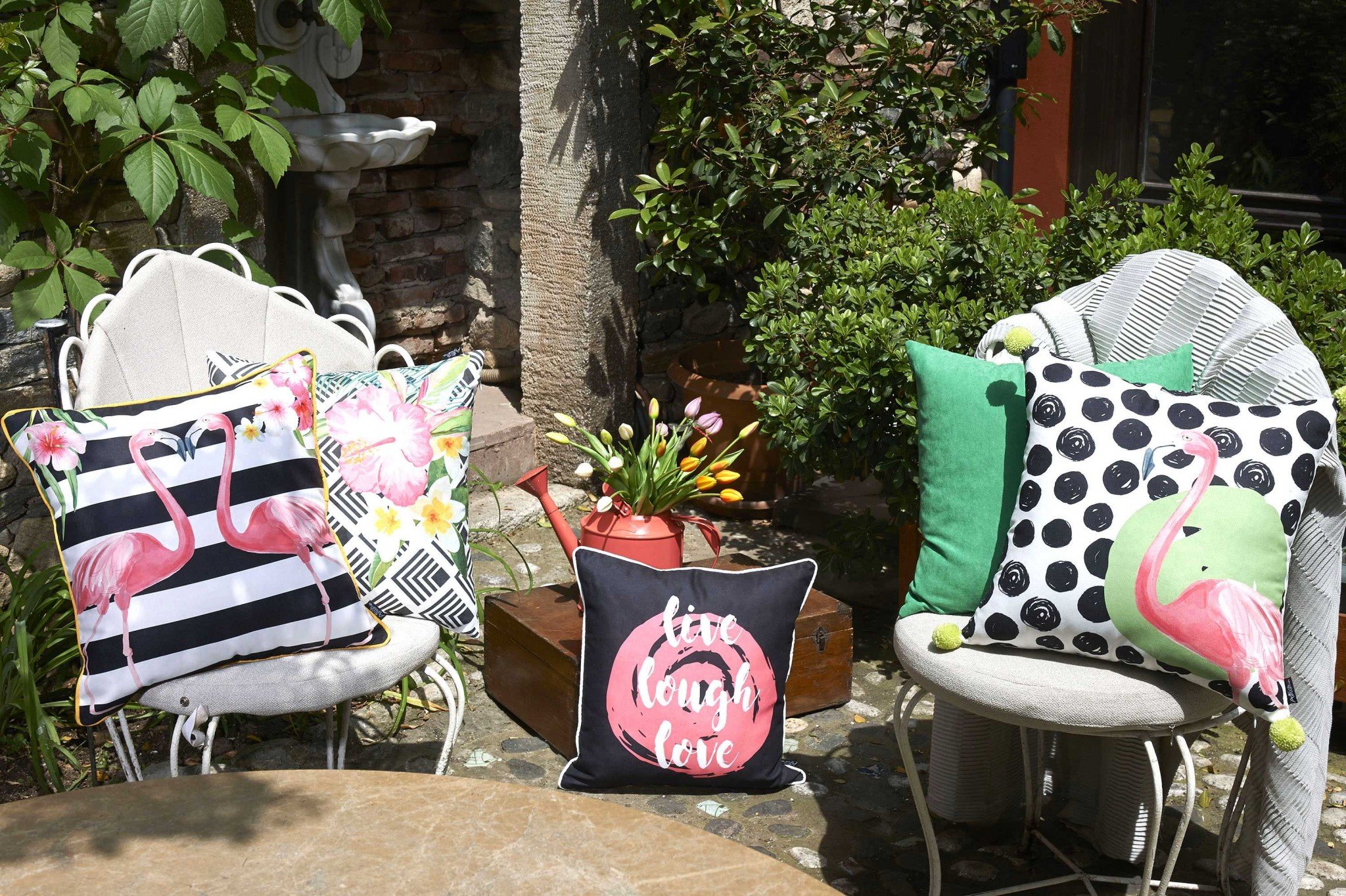 Black and white decorative throw pillow cover featuring flamingo lovers design with gold piping and hidden zipper closure.