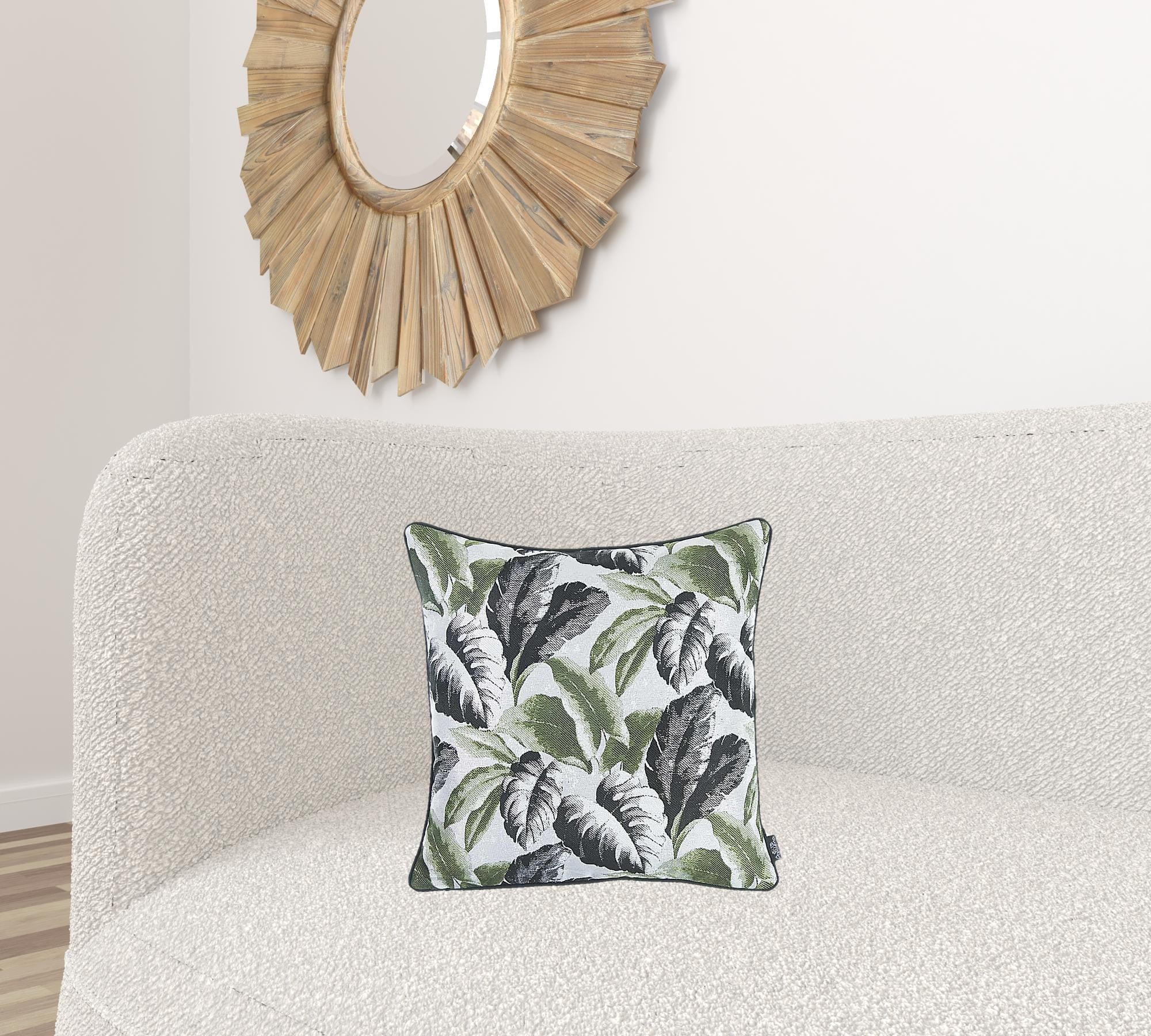 Black White and Green Tropical Leaf Throw Pillow Cover featuring a vibrant tropical leaf design with black binding and hidden zipper closure.