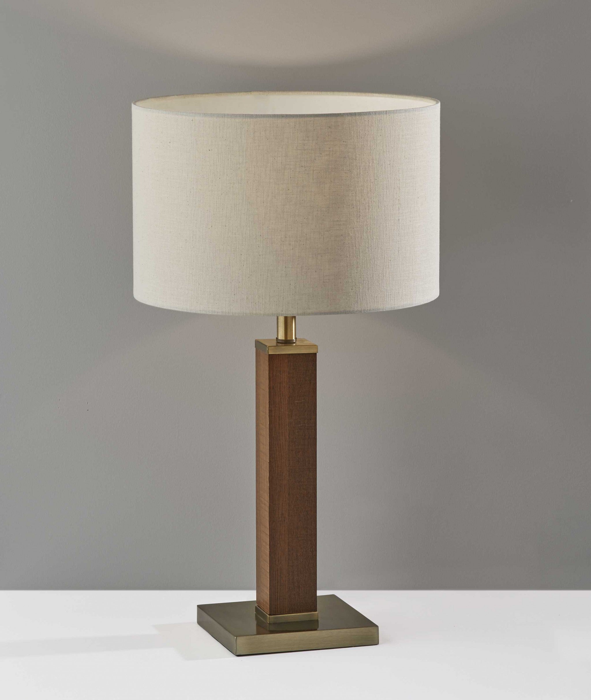 Black Wood Monument Table Lamp featuring a rustic design with a textured light grey fabric shade and black metal accents.