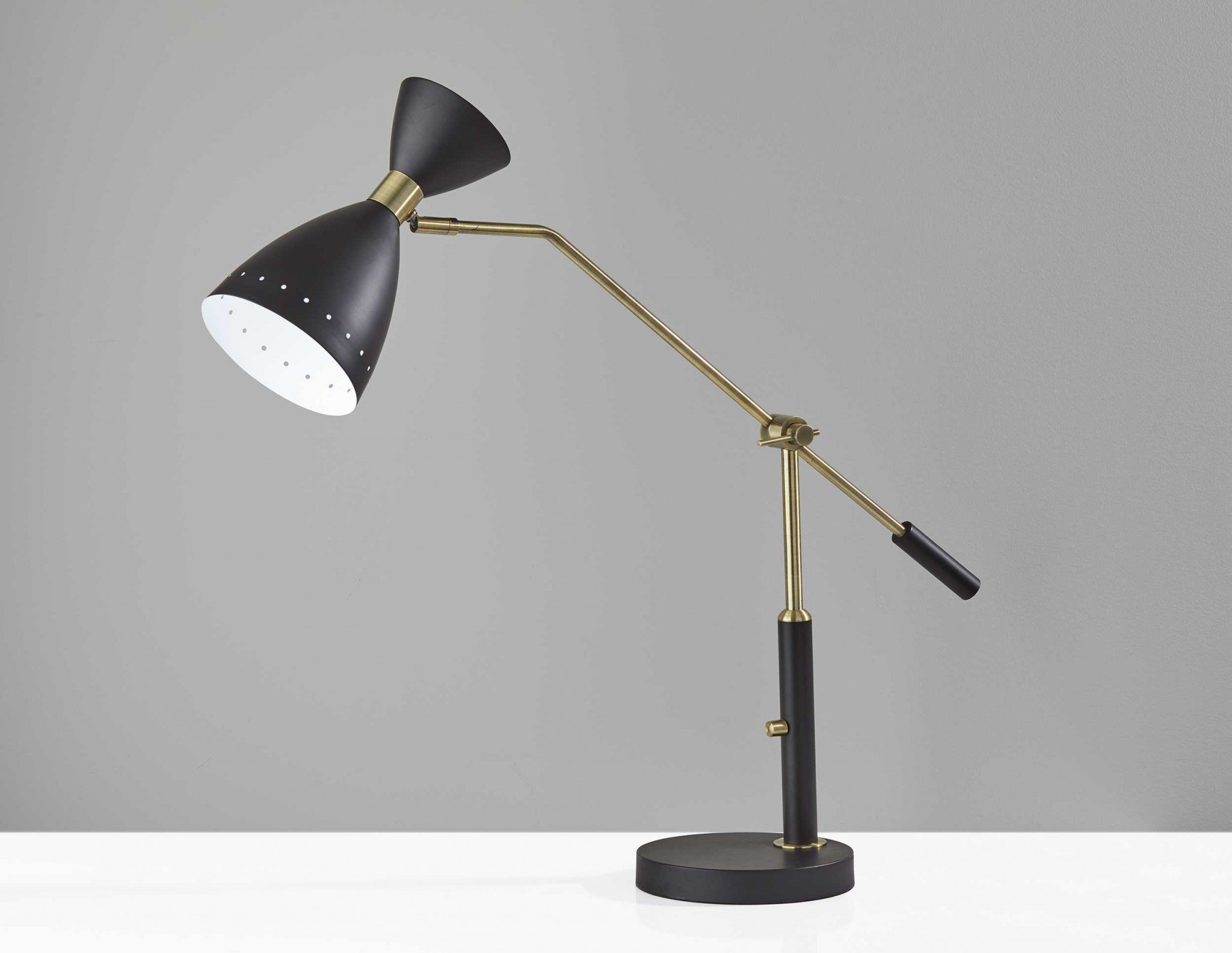 Brass Cinch Black Metal Adjustable Desk Lamp with oversized shade and adjustable arm, showcasing mid-century modern design.