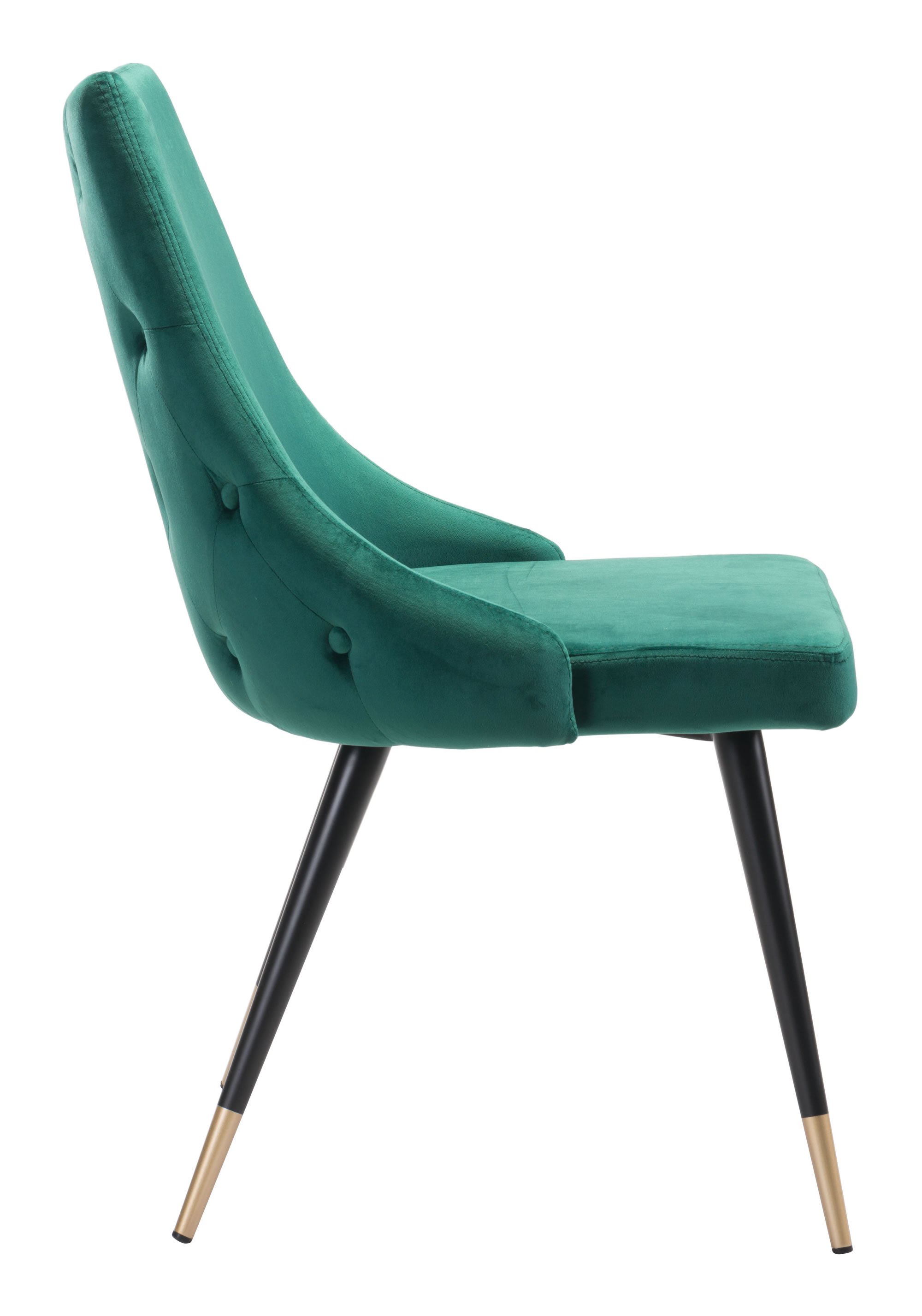 Set of two fashionable emerald green velvet dining chairs with button tufting and brushed brass legs.