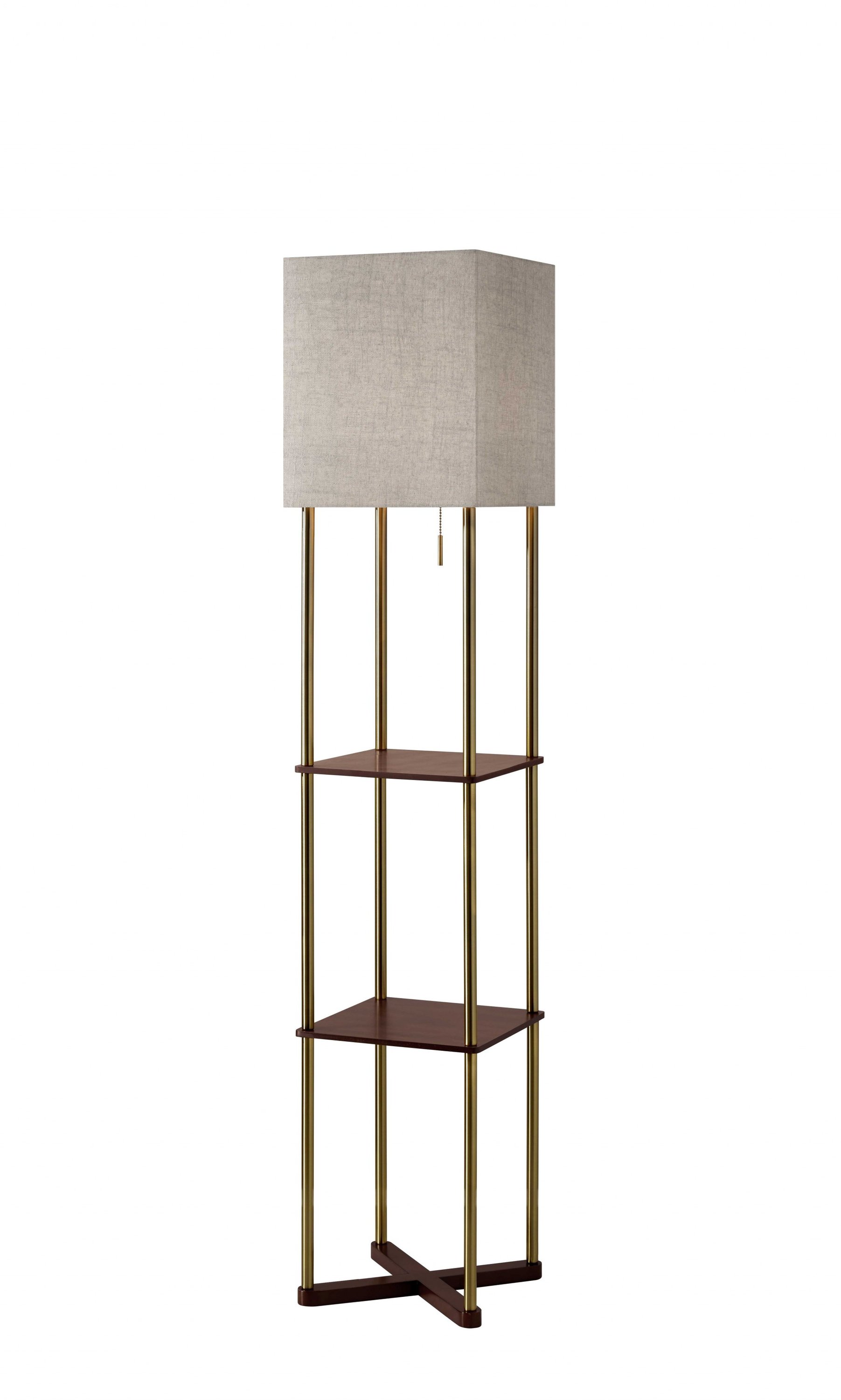 Elegant floor lamp featuring antique brass poles, walnut wood finish shelves, and a textured natural linen shade, perfect for modern decor.