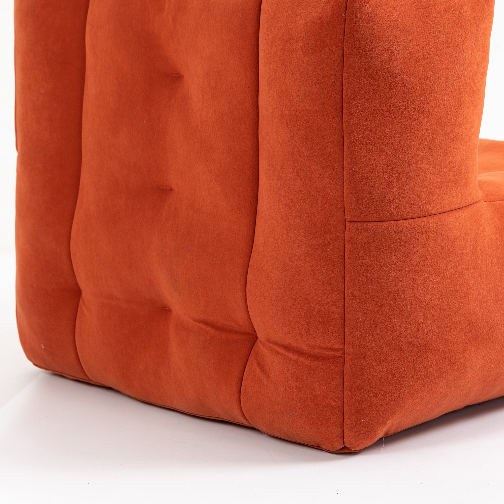 Fluffy bean bag chair in vibrant red velvet, designed for comfort and support for both adults and children.