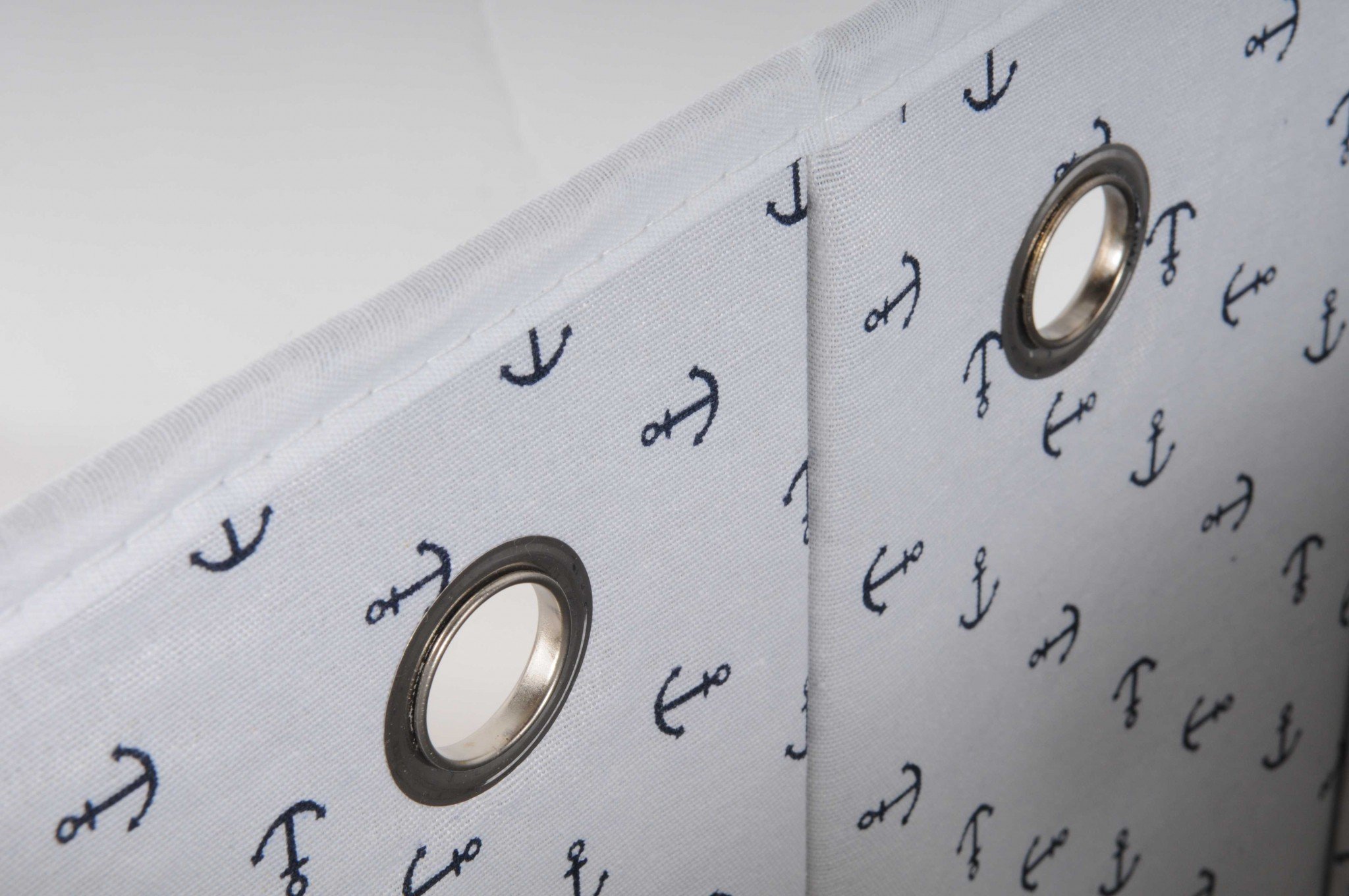 Foldable navy blue fabric lined storage basket, spacious and stylish, perfect for organizing pillows, blankets, and laundry.