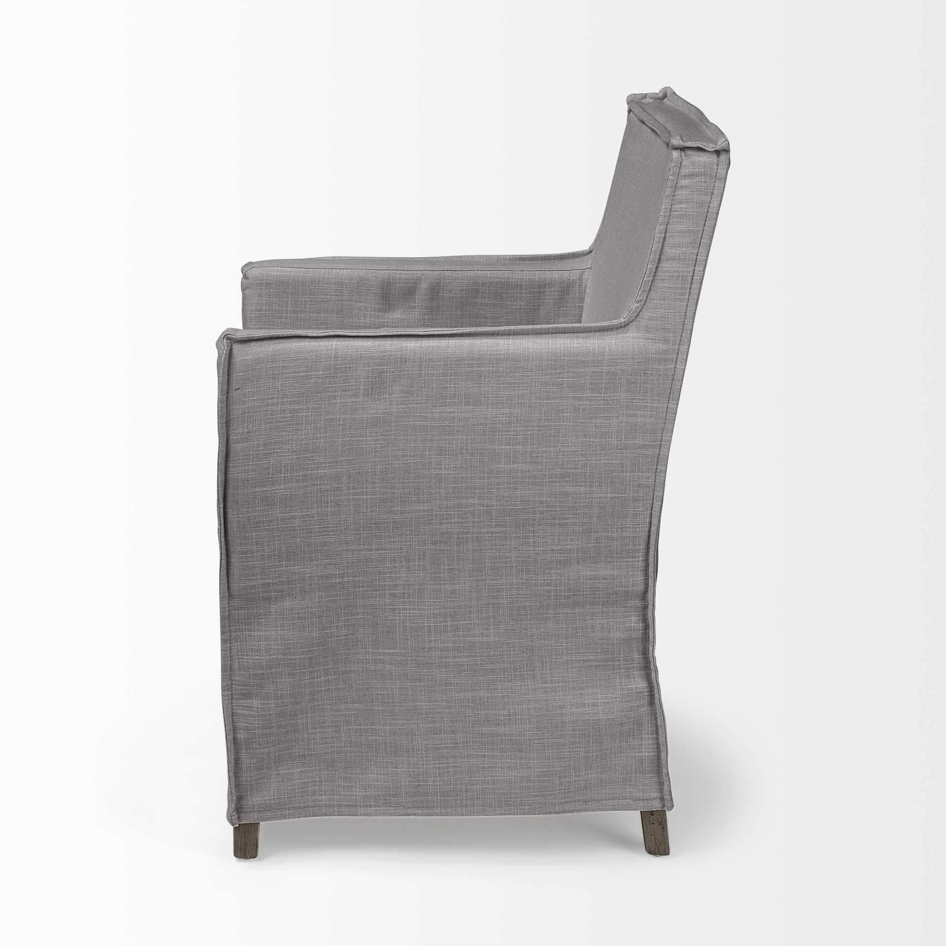 Grey fabric dining chair with a brown wooden base, showcasing a modern design and comfortable seating.
