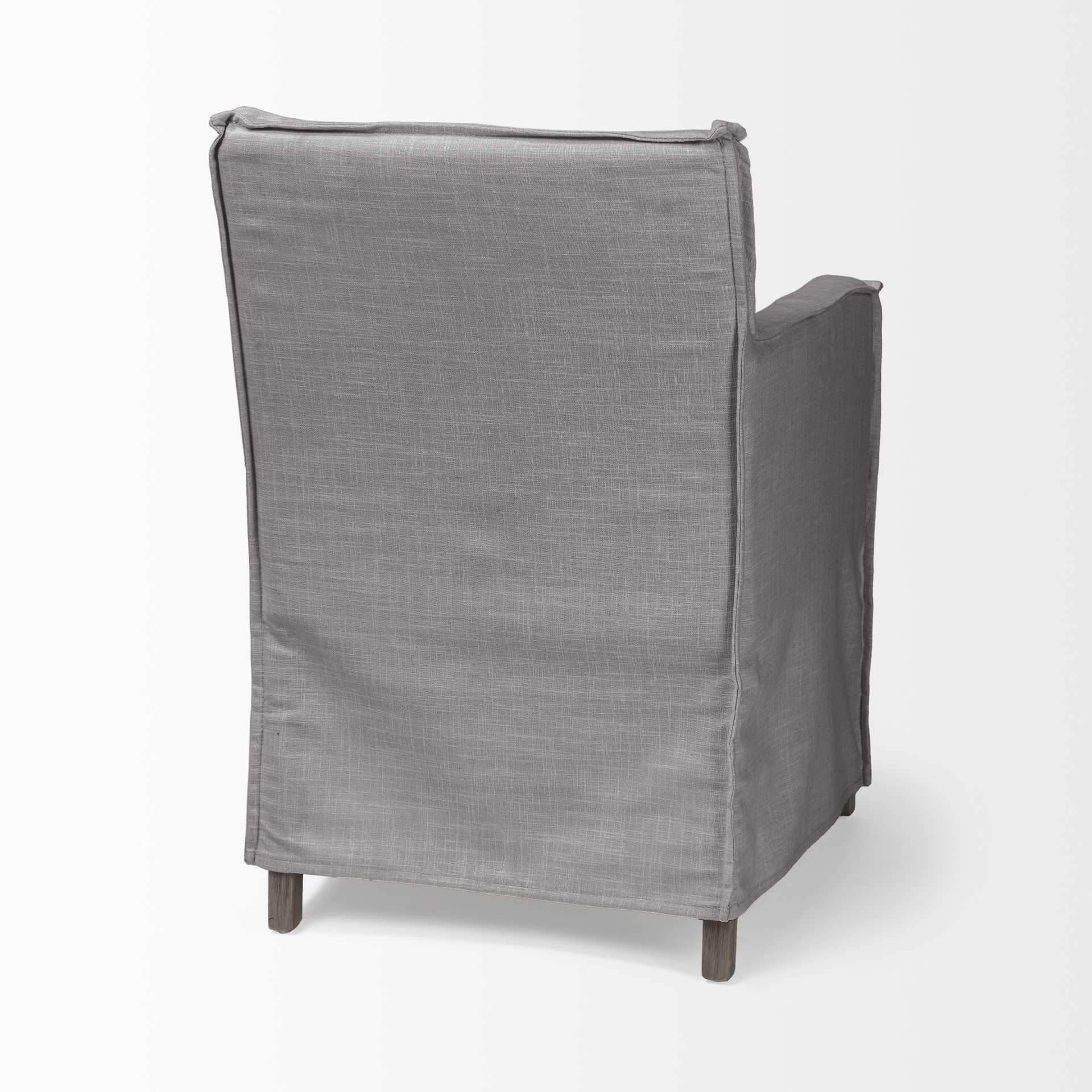 Grey fabric dining chair with a brown wooden base, showcasing a modern design and comfortable seating.