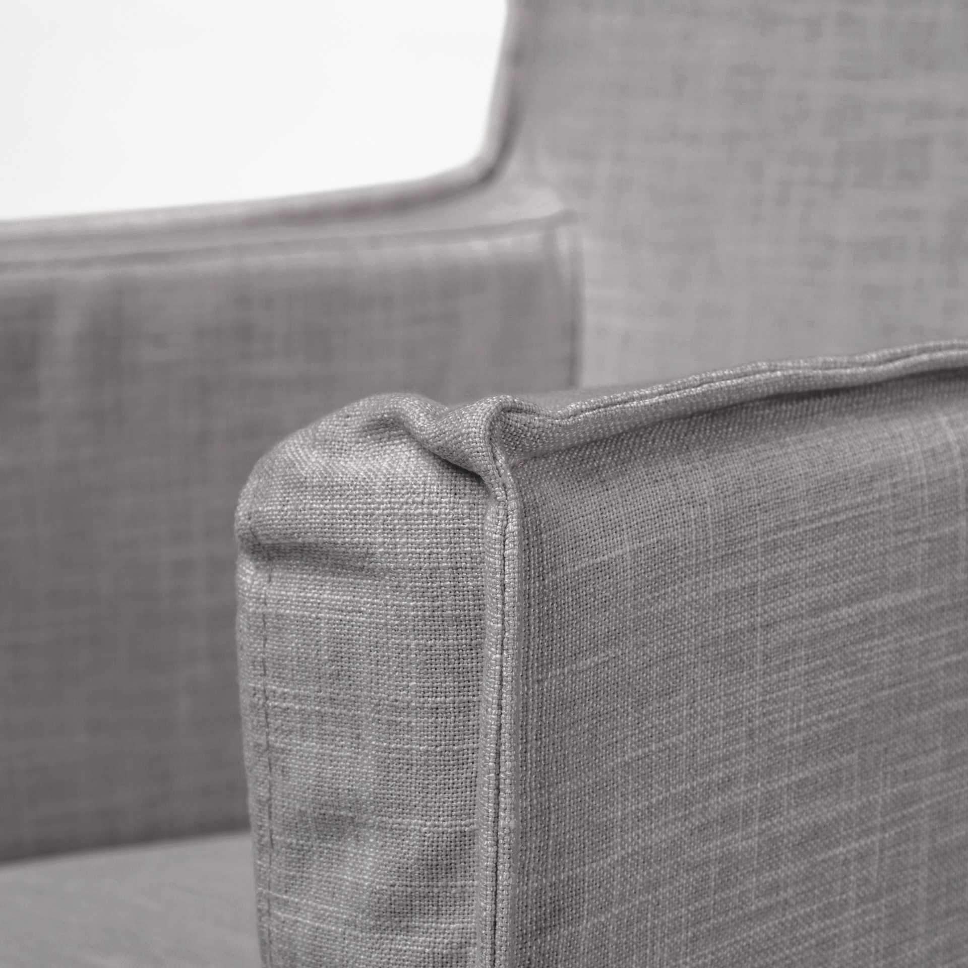 Grey fabric dining chair with a brown wooden base, showcasing a modern design and comfortable seating.