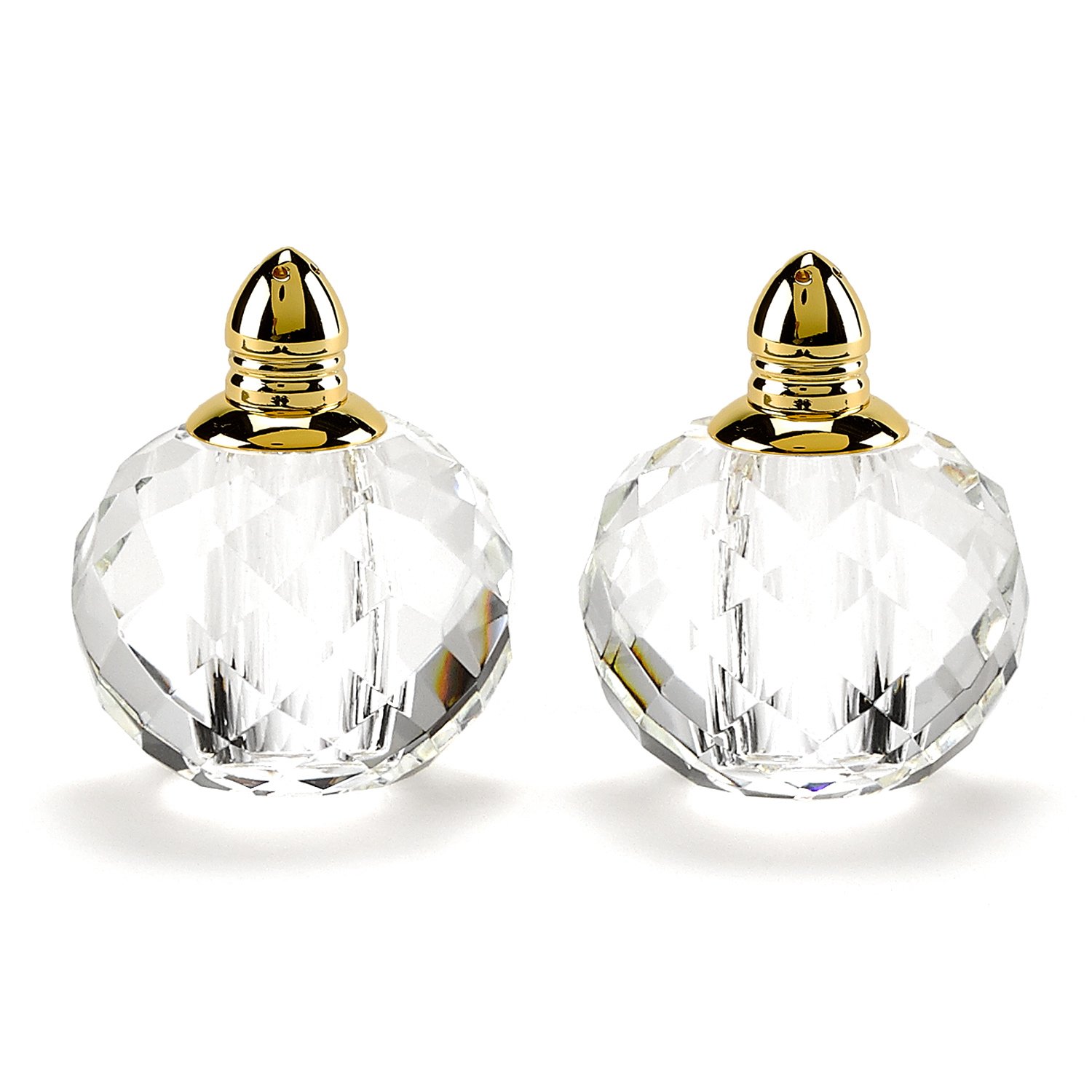 Handcrafted optical crystal and gold rounded salt and pepper shakers, showcasing elegant design and luxurious accents.