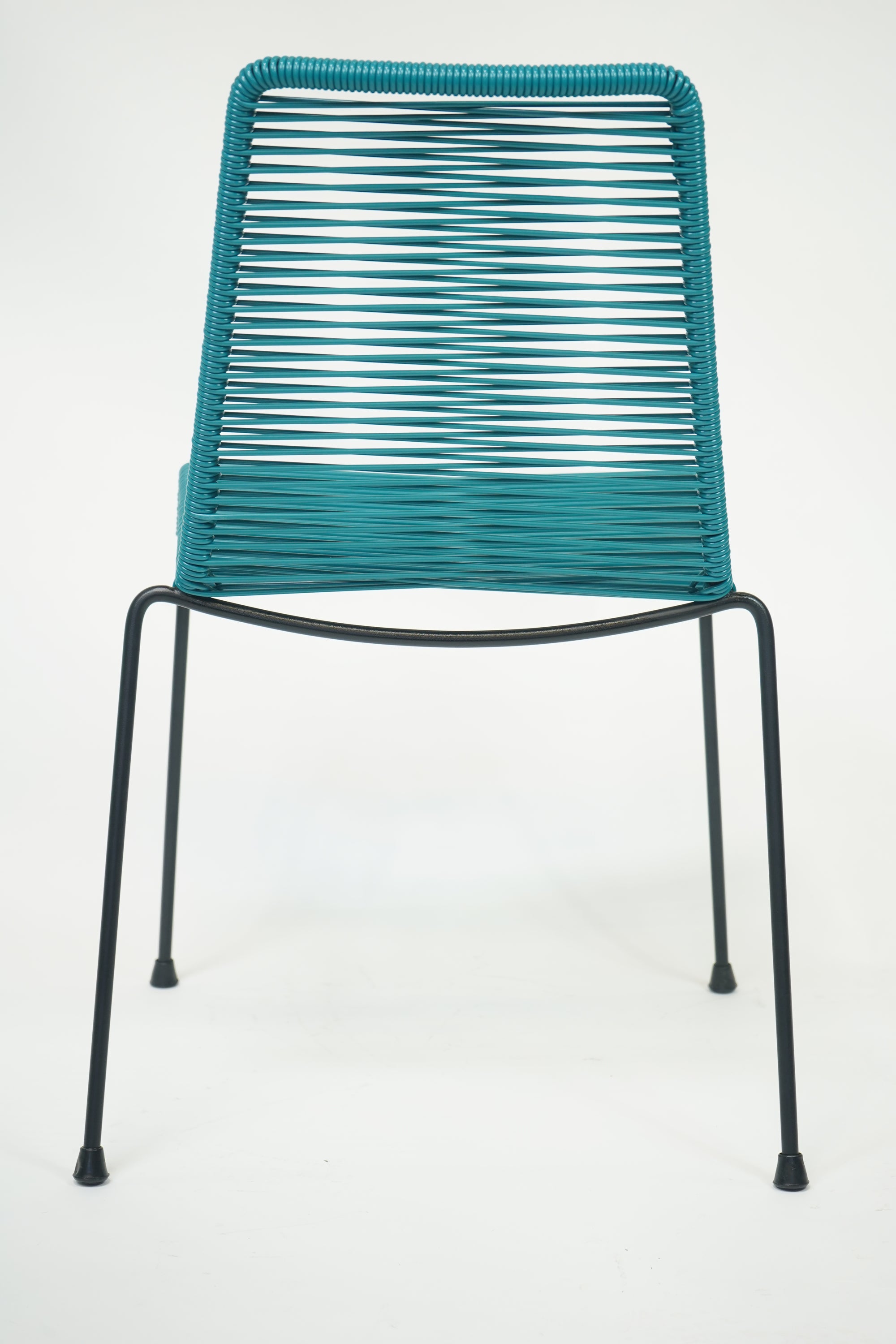 La Turquesa Chair in vibrant turquoise and black, showcasing its contemporary design and inviting curves.