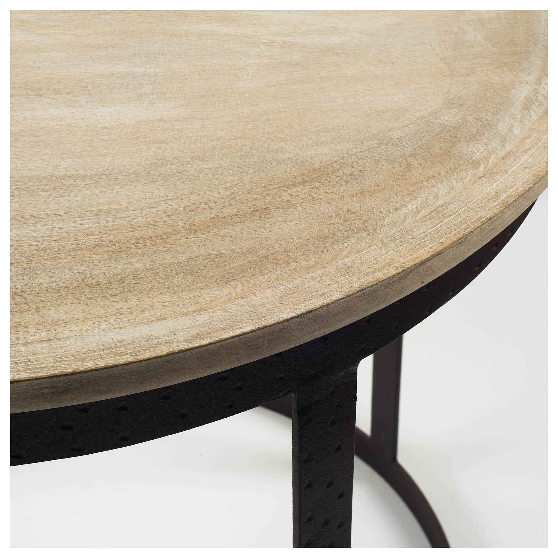 Light brown wood round top accent table with a sturdy black metal base, showcasing a distressed finish and elegant design.