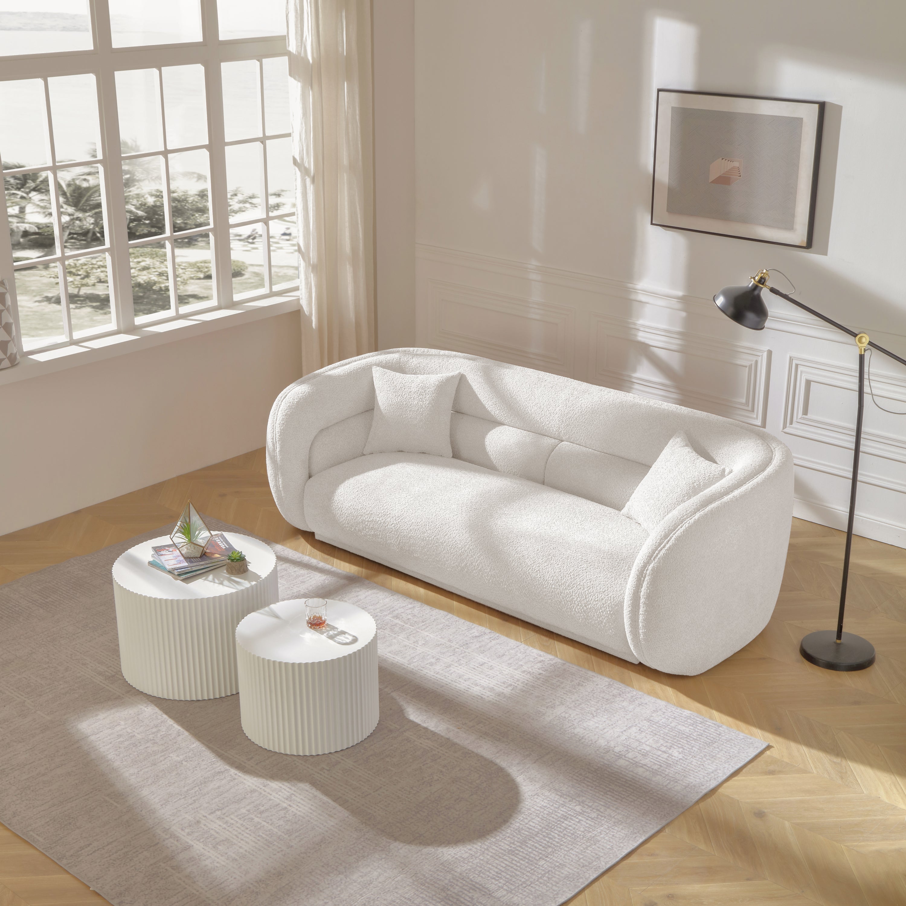 Mid Century Modern Curved Living Room Sofa in white boucle fabric, showcasing its elegant design and comfortable seating.