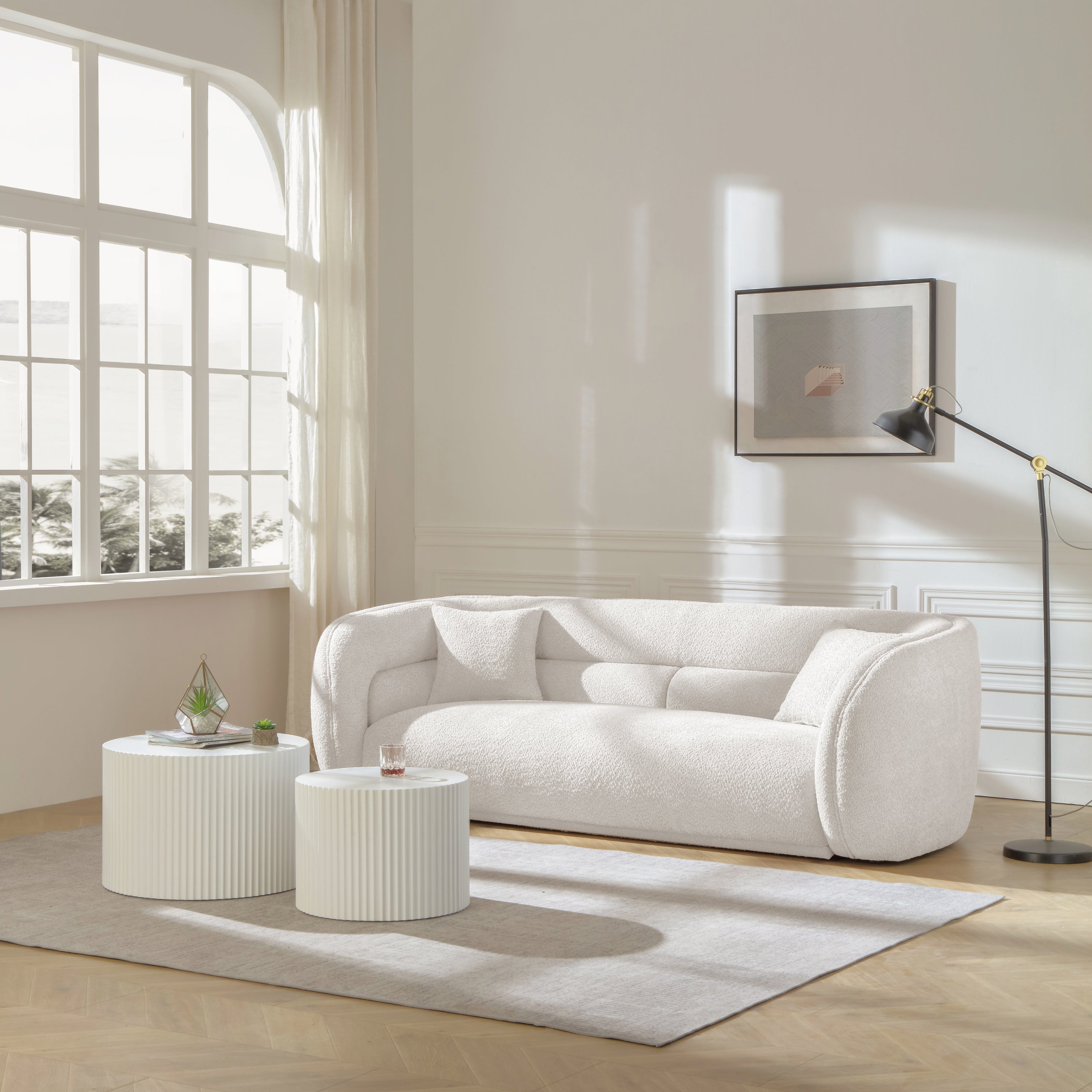 Mid Century Modern Curved Living Room Sofa in white boucle fabric, showcasing its elegant design and comfortable seating.